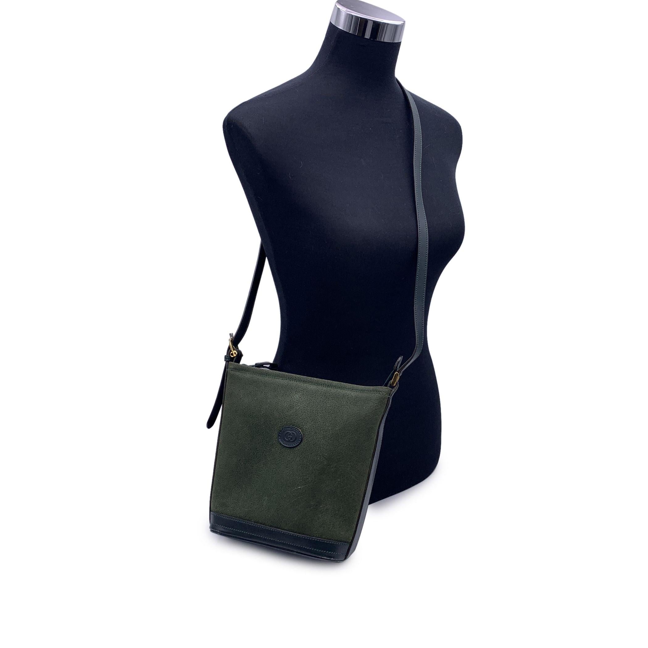 Step into a world of vintage sophistication with this stunning Gucci Green Suede and Leather Shoulder Bag. A perfect balance of classic elegance and unique style, this bag features a rich green suede exterior paired with luxurious leather accents,