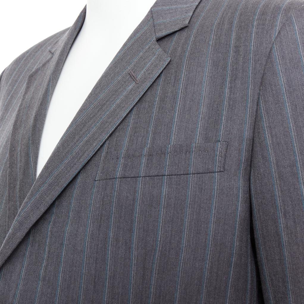 GUCCI Vintage grey blue wool cashmere pinstripe blazer IT52 XL
Reference: TGAS/E00661
Brand: Gucci
Material: Wool, Cashmere
Color: Grey, Blue
Pattern: Pinstriped
Closure: Button
Lining: Black Fabric
Extra Details: Padded shoulder. Hand-stitched
