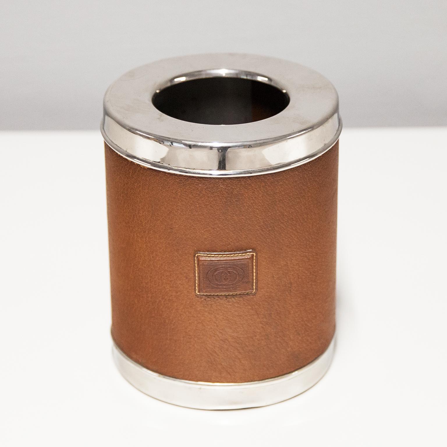 Gucci Vintage wine cooler or ice bucket made in chrome with a brown leather border with a stitched Gucci sign and signed with Gucci and the bottom. Very good vintage condition.