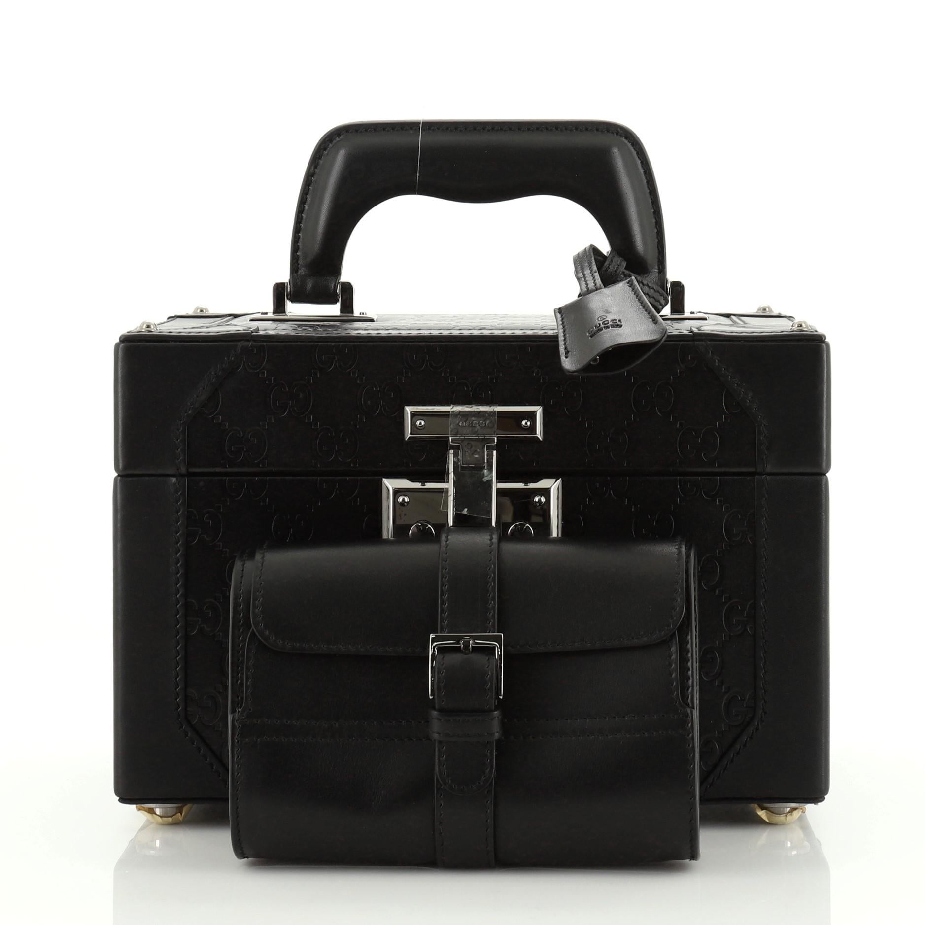 This Gucci Vintage Jewelry Box Guccissima Leather, crafted from black guccissima leather, features a single top handle, protective base studs and gunmetal-tone hardware. It opens to a green velvet interior. 

Condition: Great. Scuffs on exterior and