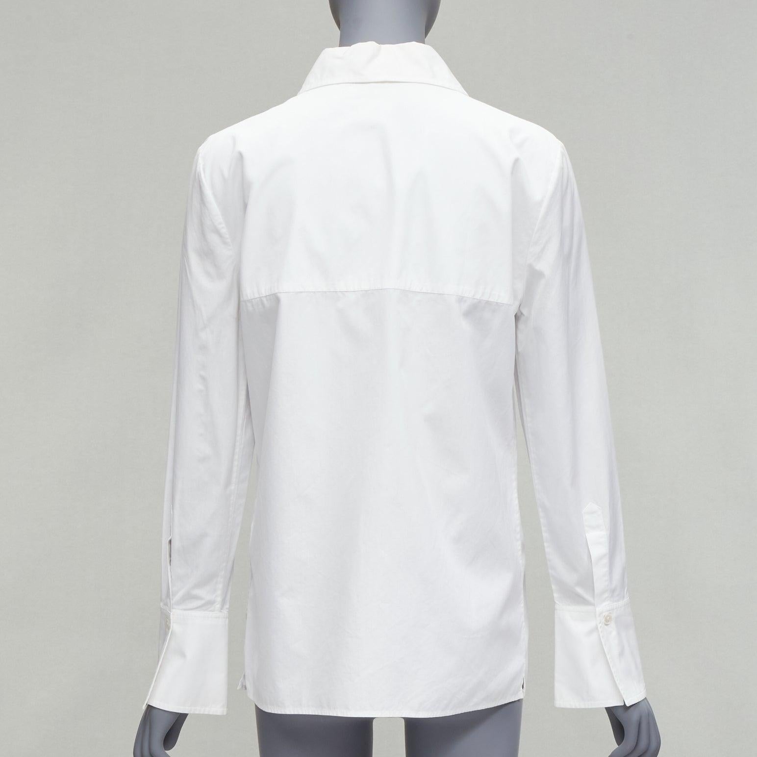 GUCCI Vintage white minimal wide collar angular bust dart panelled dress shirt IT40 S
Reference: CNPG/A00031
Brand: Gucci
Designer: Tom Ford
Material: Feels like cotton
Color: White
Pattern: Solid
Closure: Button
Extra Details: Bust darts enhances