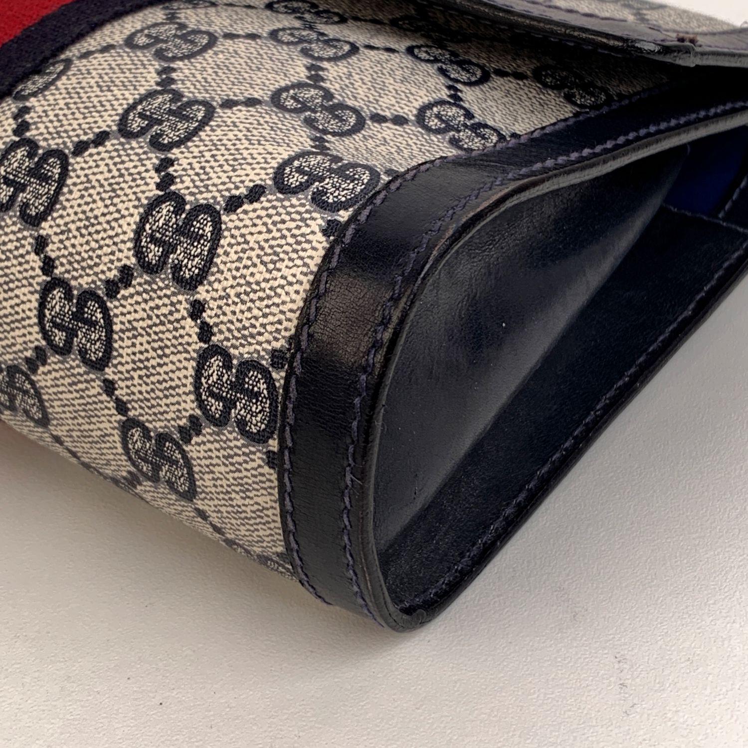 Women's Gucci Vintage Monogram Canvas Flap Cosmetic Bag Clutch with Stripes