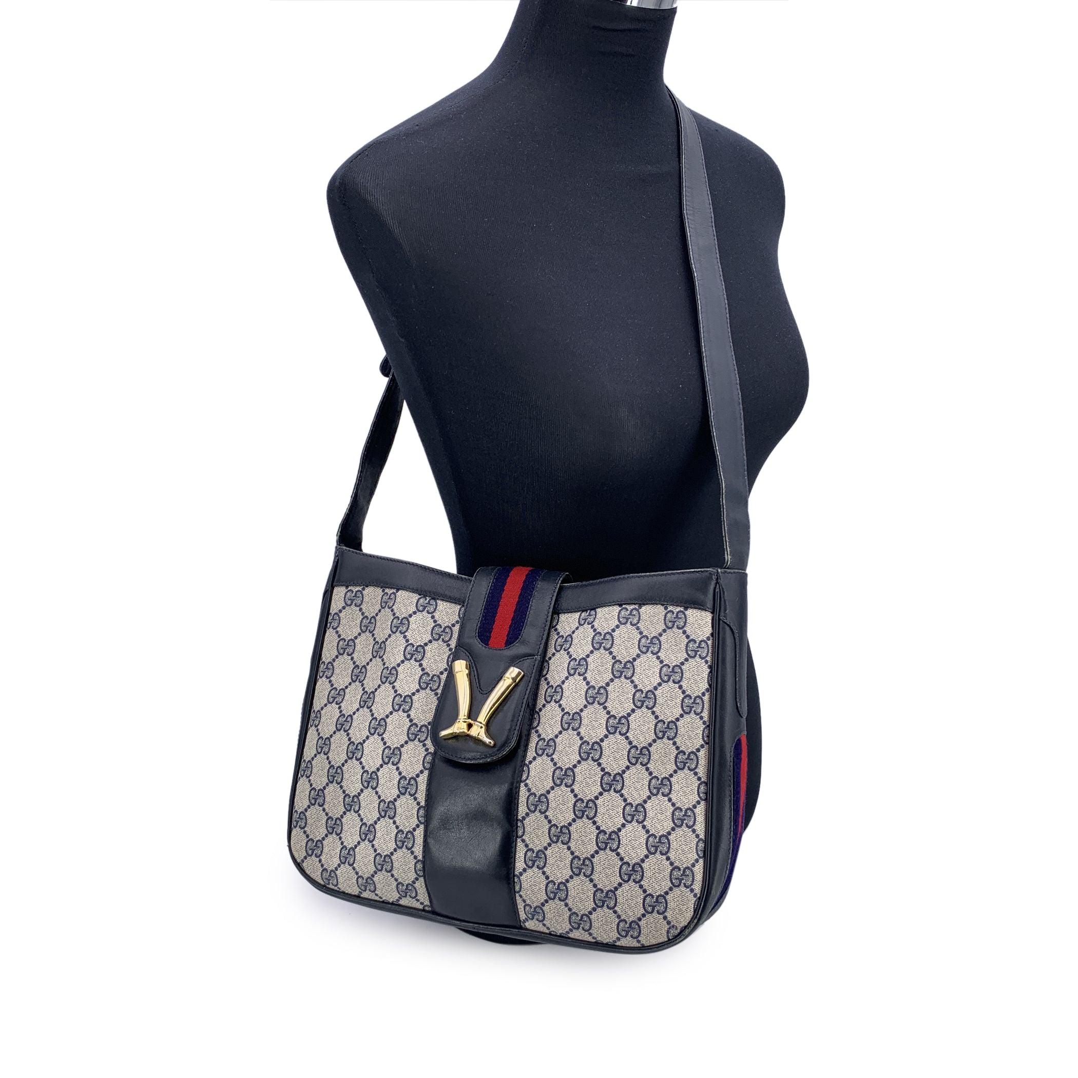 A true classic from GUCCI's elegant archives, this vintage monogram shoulder bag captures the quiet sophistication of an earlier era. Crafted in the brand's signature blue GG monogram canvas, the bag is trimmed with smooth genuine leather and