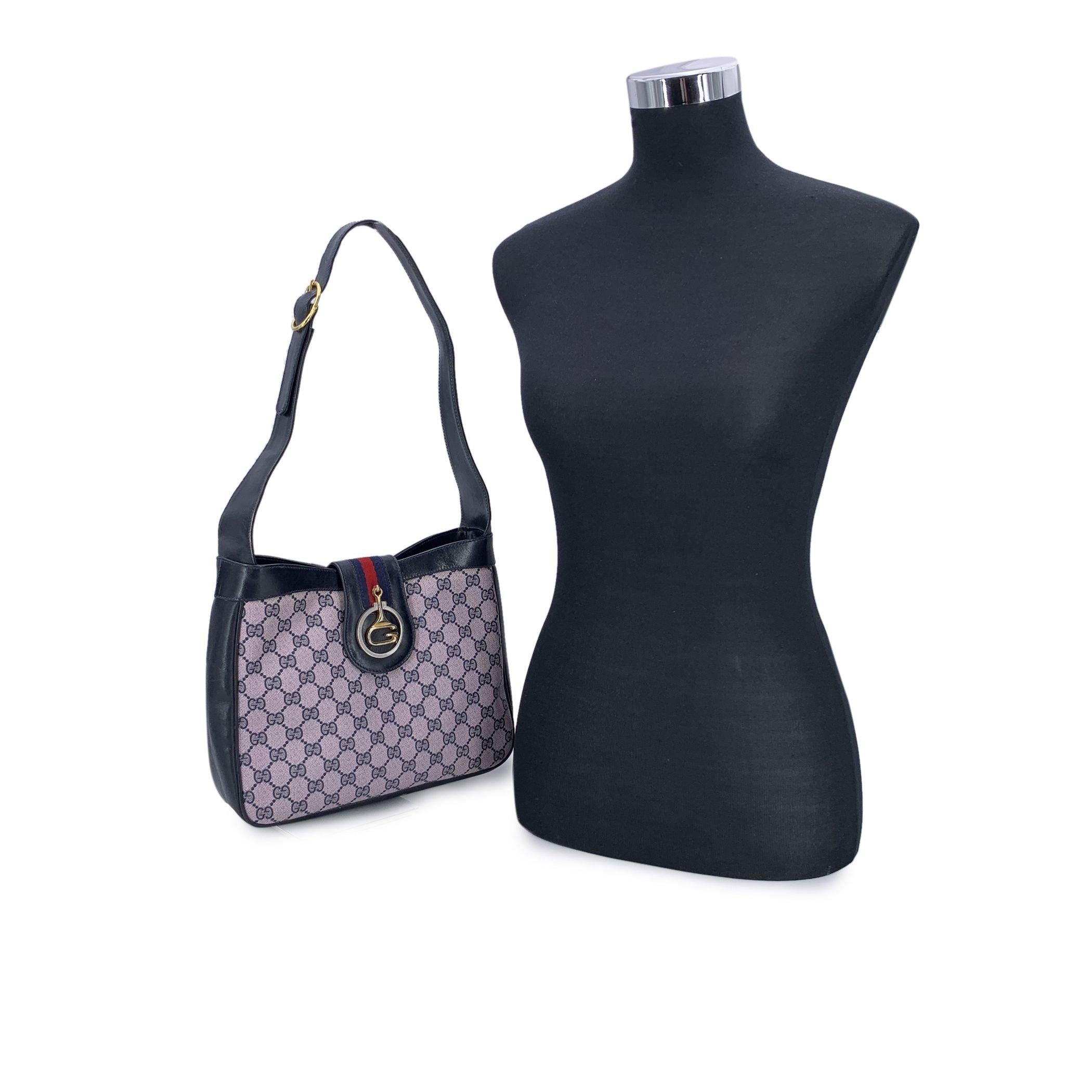 A true classic from GUCCI's elegant archives, this vintage monogram shoulder bag captures the quiet sophistication of an earlier era. Crafted in the brand's signature blue GG monogram canvas, the bag is trimmed with smooth genuine leather and