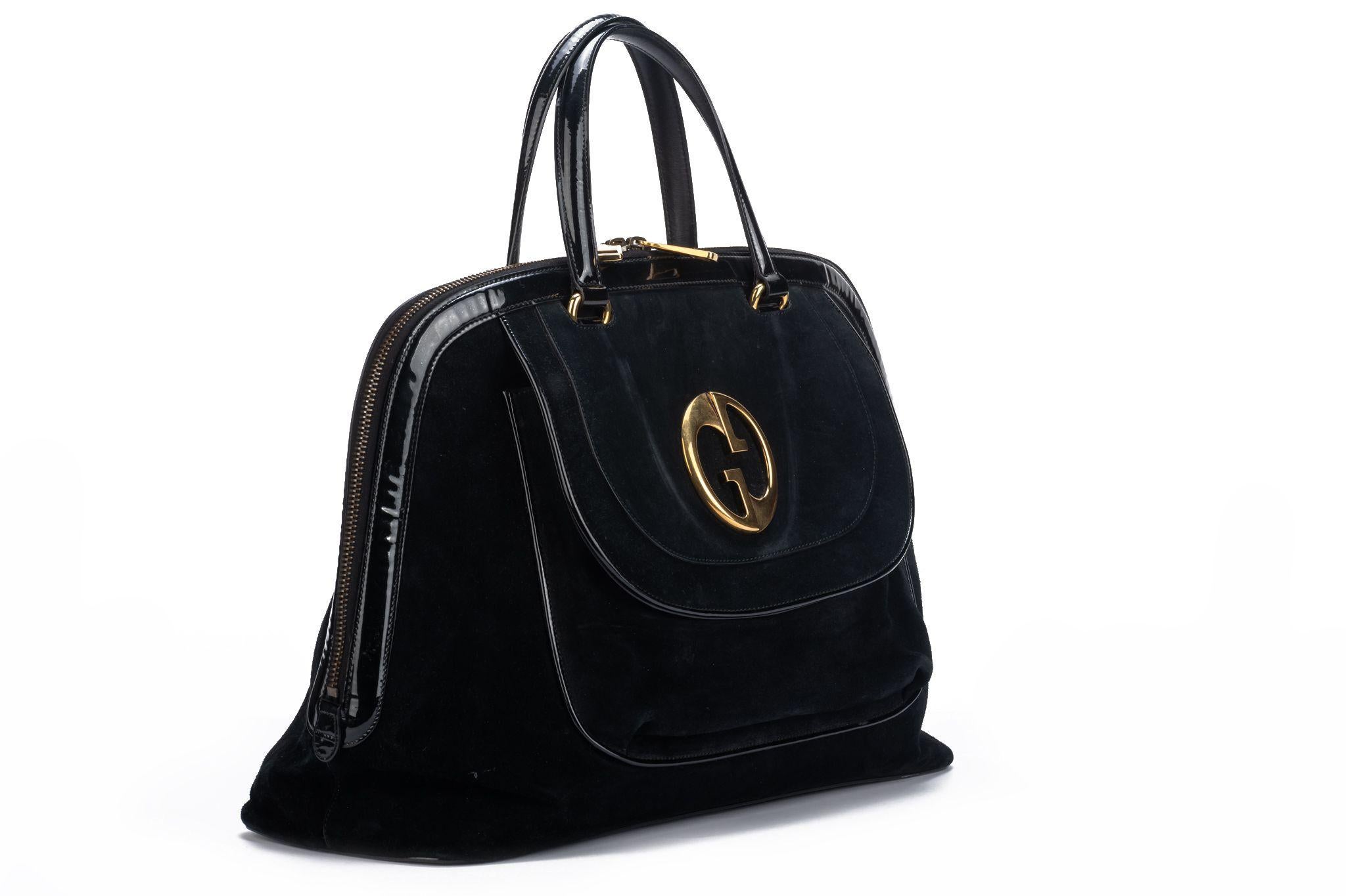Gucci vintage oversize black suede travel bag with patent leather trim and large logo in gold hardware. Generic dust cover.
