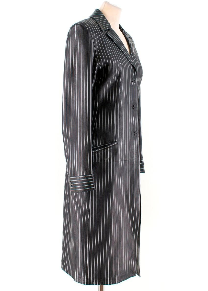 Gucci Vintage Pinstriped Leather Coat

- Black leather vintage coat
- Collar with notch lapels
- Button fastening
- Front pockets
- Long sleeves with buttoned cuffs
- Lined

Please note, these items are pre-owned and may show some signs of storage,