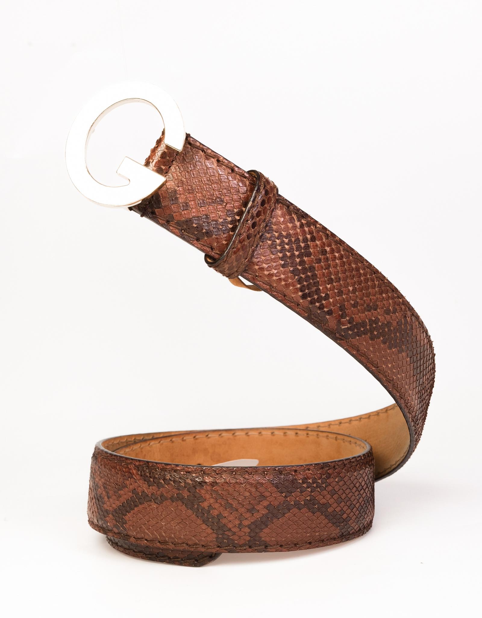 2-tones python Gucci vintage belt with a rare single G buckle in gold tone brass. Inside is genuine leather.

COLOR: Brown - python
ITEM CODE: 203742.497717
MATERIAL: Leather python
MEASUREMENTS: L 37” x W 1”
SIZE:  85.34
EST. RETAIL: $850
COMES
