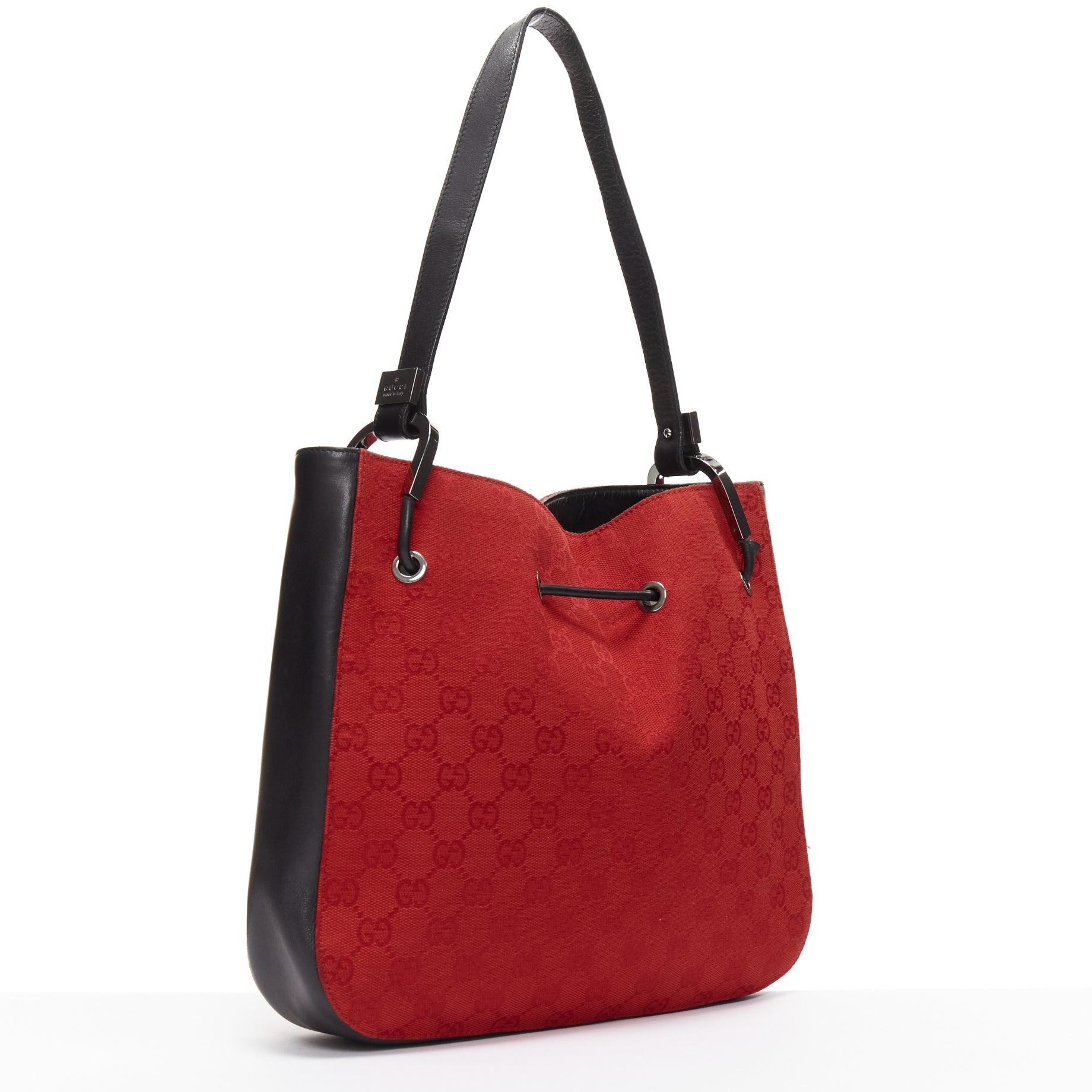GUCCI Vintage red GG monogram canvas black leather drawstring bag
Reference: KNCN/A00046
Brand: Gucci
Material: Fabric, Leather
Color: Red, Black
Pattern: Monogram
Closure: Drawstring
Lining: Black Leather
Extra Details: This shoulder bag features a