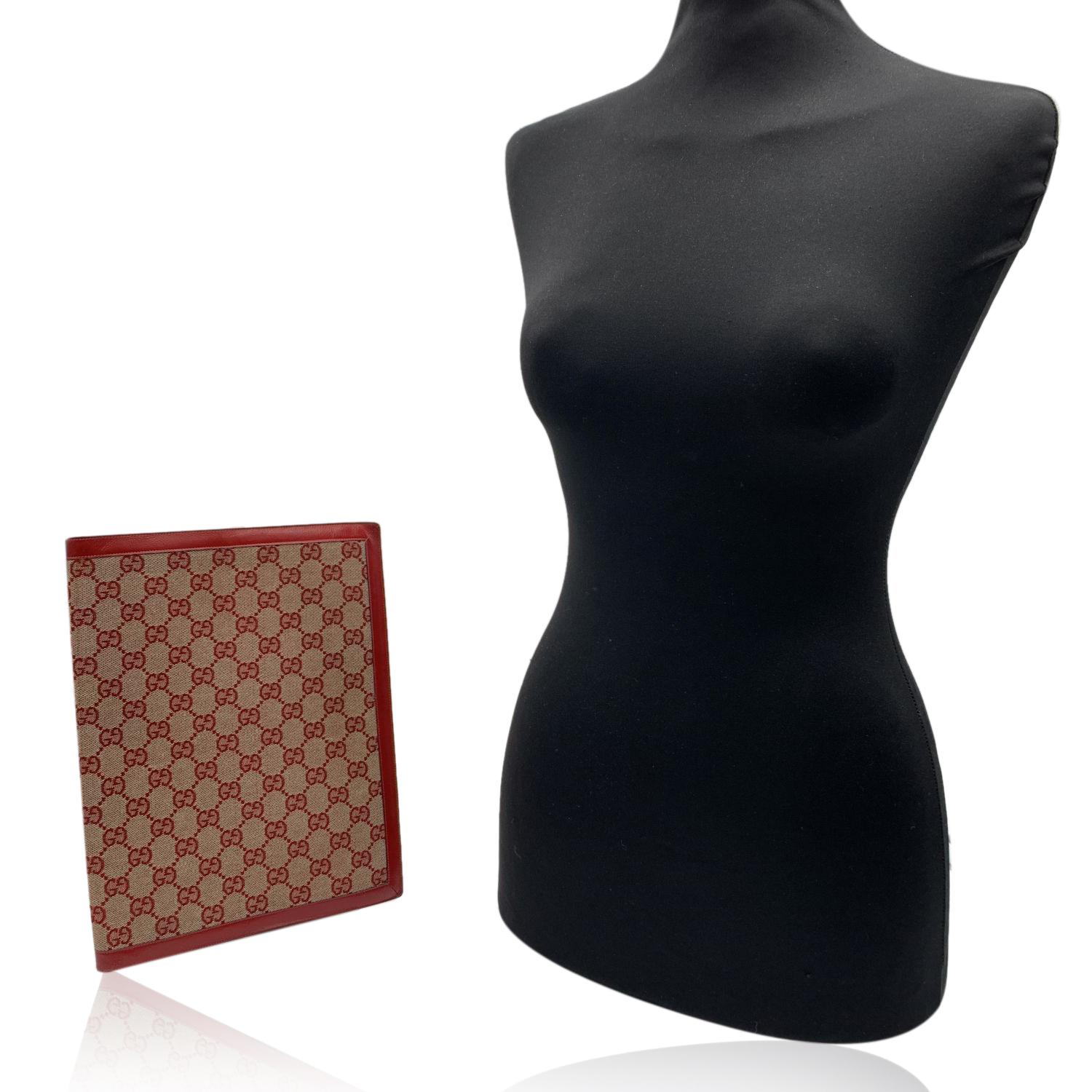 Elegant vintage agenda cover by GUCCI crafted in red monogram canvas. Red leather interior. It features 2 slots inside.Logos / Tags: 'Made in Italy by GUCCI' embossed inside. Measurements: 11 x 6.5 inches - 27,9 x 16.5 cm


Details

MATERIAL: