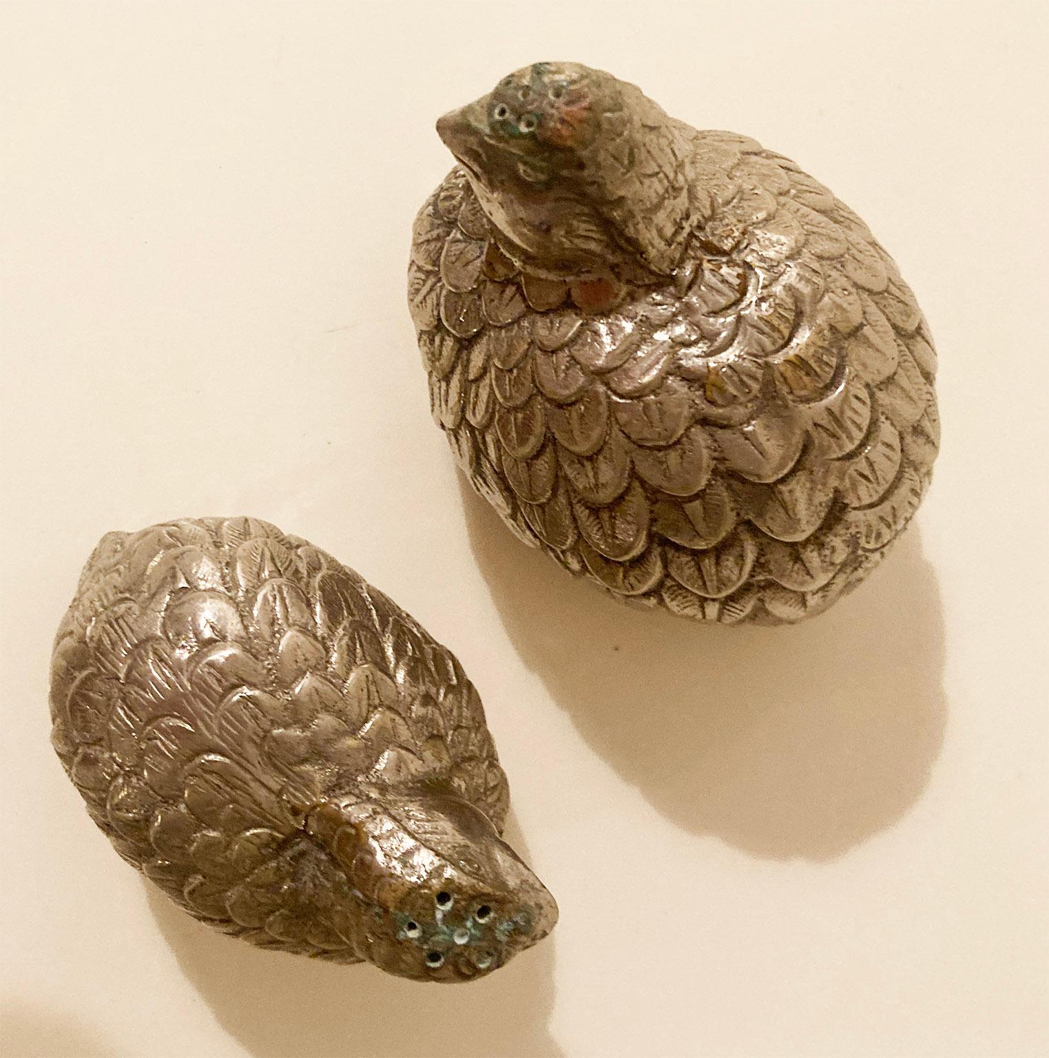 The Quails. Le Quaglie.
Designed by Gucci in 1970ca,
 are an iconic elegant set of salt and pepper shakers in silver plate metal, 
With the shape of quails. 
Engraved mark GUCCI MADE IN ITALY, on the bottom.