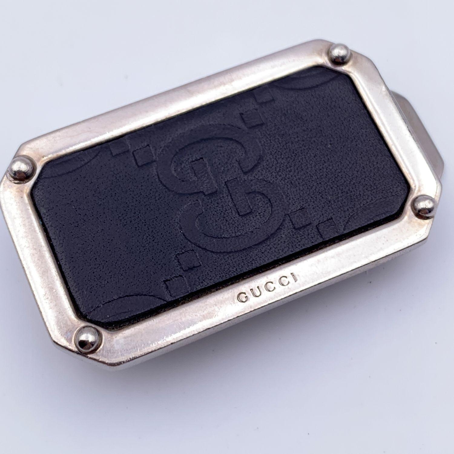 Vintage Gucci money clip in silver metal and black monogram leather. Rectangular shape. Height: 2 inches - 5.1 cm. Width: 1.10 inches - 3 cm. Marked 'Gucci - Made in Italy' on the clip.

Details

MATERIAL: Metal

COLOR: Black

MODEL: -

GENDER: