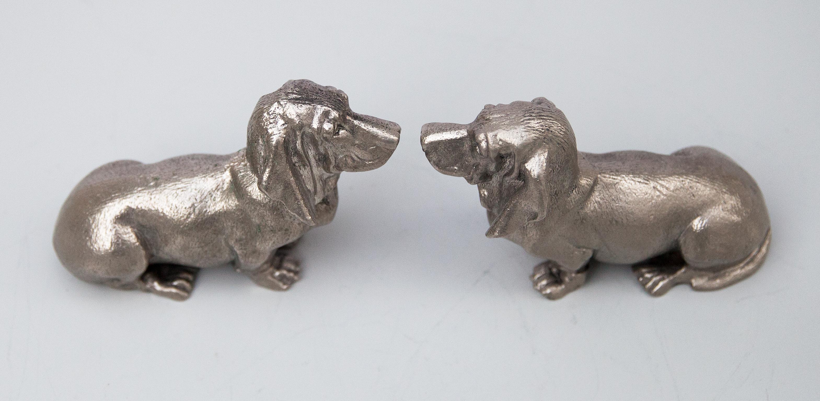 Pair of decorative bassets dogs in silver plated brass, signed Gucci Italy on the bottom.
   