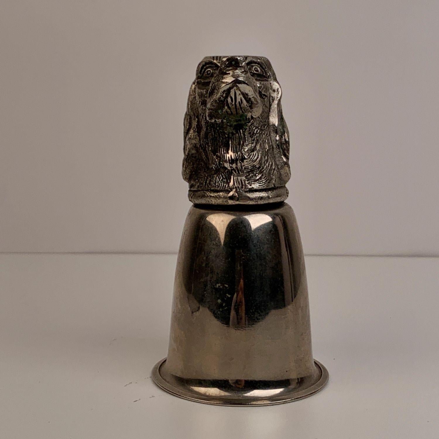 Vintage Gucci dog's head cup from the 70s. Silver plated cup and pewter head. It can sit safely either way up or down. Marked GUCCI ITALY. Height: 5.5 inches - 14 cm. Cup's diameter: 3 inches - 7,6 cm

Details

MATERIAL: Metal

COLOR: Silver

MODEL: