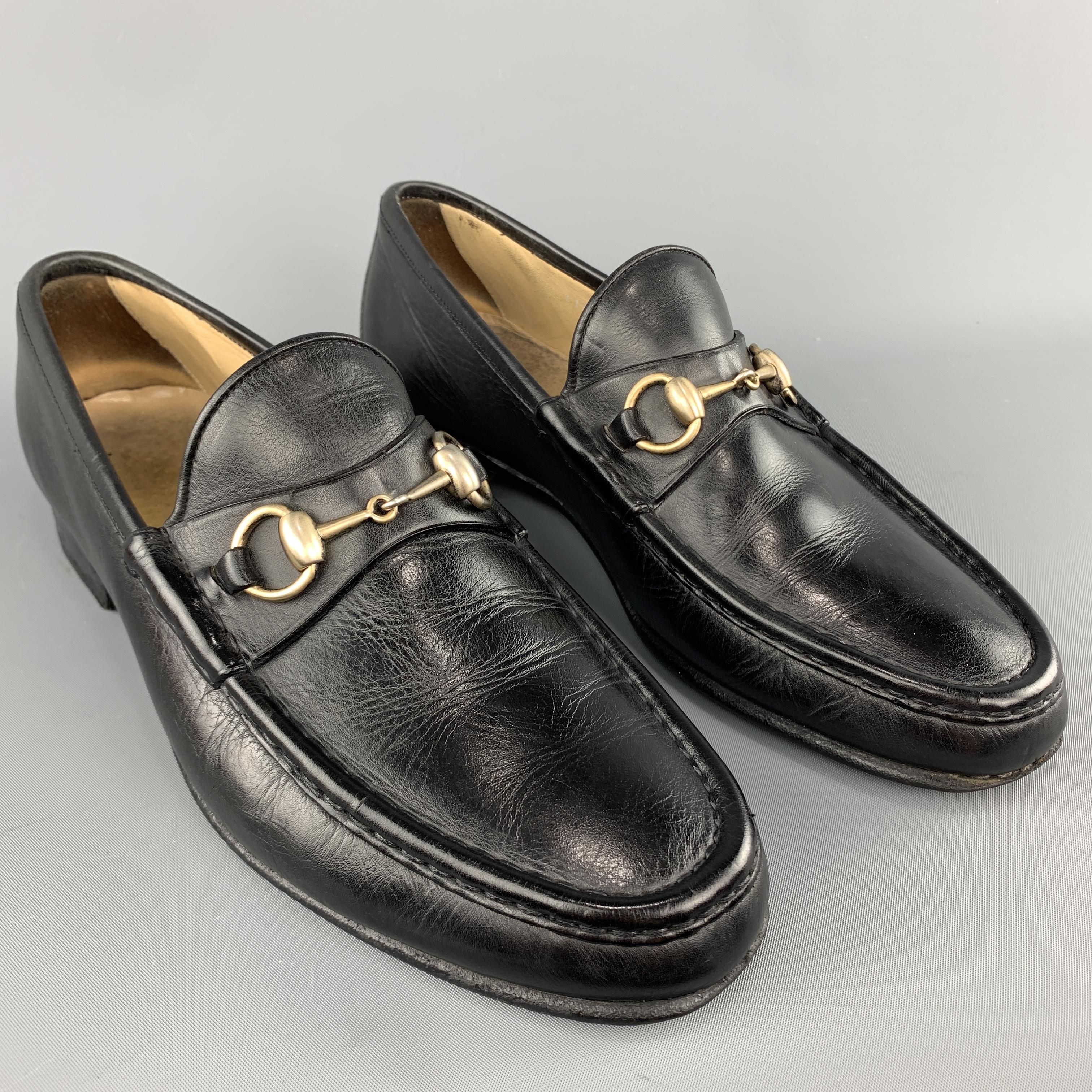 Vintage Gucci loafers come in black leather with an apron toe and light gold tone horsebit hardware. Wear throughout. As-is. Made in Italy.
 

Good Pre-Owned Condition.
Marked: IT 43.5

Outsole: 11.15 x 3.75 in.