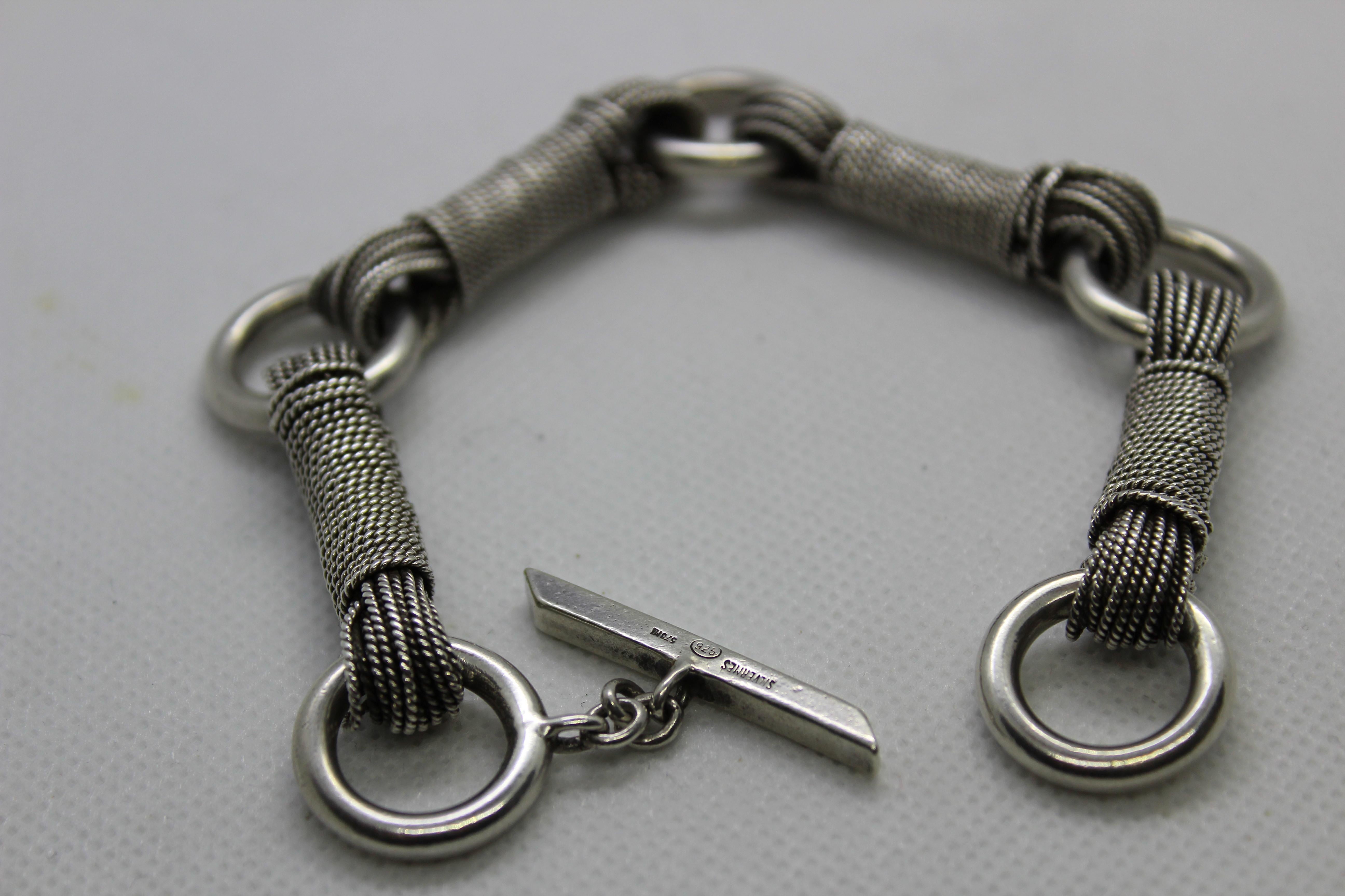 Sterling Silver Gucci Italy bracelet.

Made in Italy, 1980s 

Tight rope link with toggle clasp.