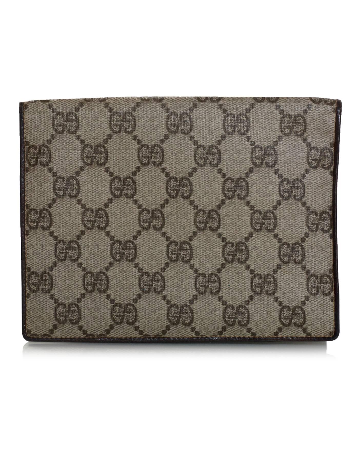 Gucci Vintage Tan Monogram Supreme Passport Cover
Can also be used as a wallet and features three zip pockets at back

Made In: Italy
Color: Tan, brown
Materials: Coated canvas, leather
Lining: Brown leather
Closure/Opening: Bi-fold
Exterior