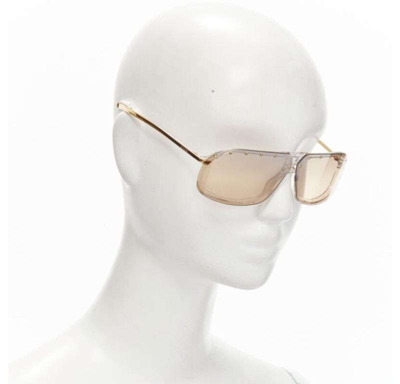 GUCCI Vintage Y2K GG2517/S AU3 gold GG logo brown lens studded sheild sunglasses
Reference: ANWU/A00847
Brand: Gucci
Model: GG2517/S AU3
Material: Metal
Color: Brown
Pattern: Solid
Made in: Italy

CONDITION:
Condition: Fair, this item was pre-owned