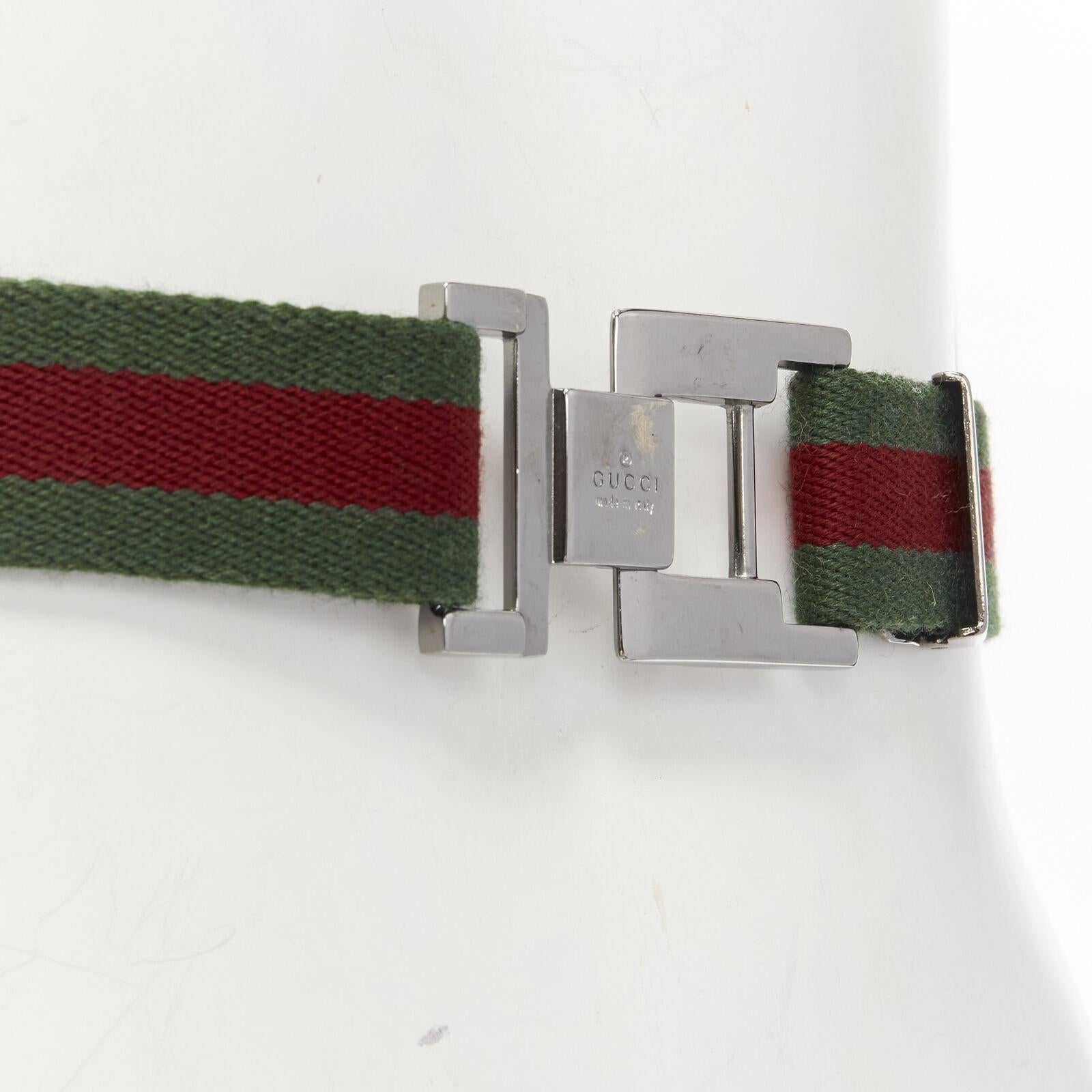 GUCCI Vintage Y2K silver ruthenium GG square buckle red green web belt
Reference: ANWU/A00868
Brand: Gucci
Color: Green, Red
Pattern: Solid
Closure: Buckle
Made in: Italy

CONDITION:
Condition: Fair, this item was pre-owned and is in fair condition.