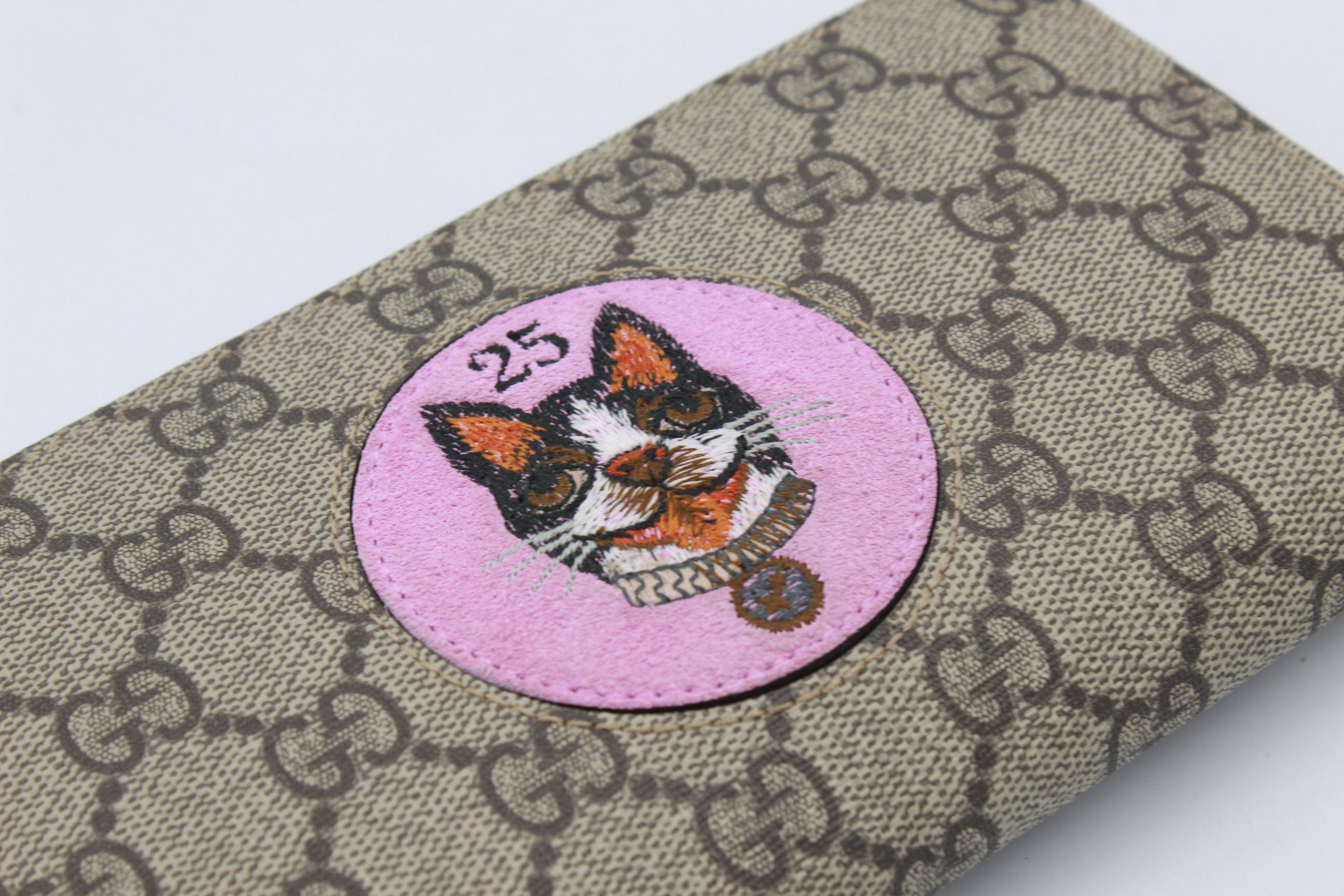 Gray Gucci wallet in monogram canvas, with Bosco patch