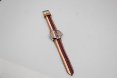 Gucci watch in brown, blue, red and white leather.