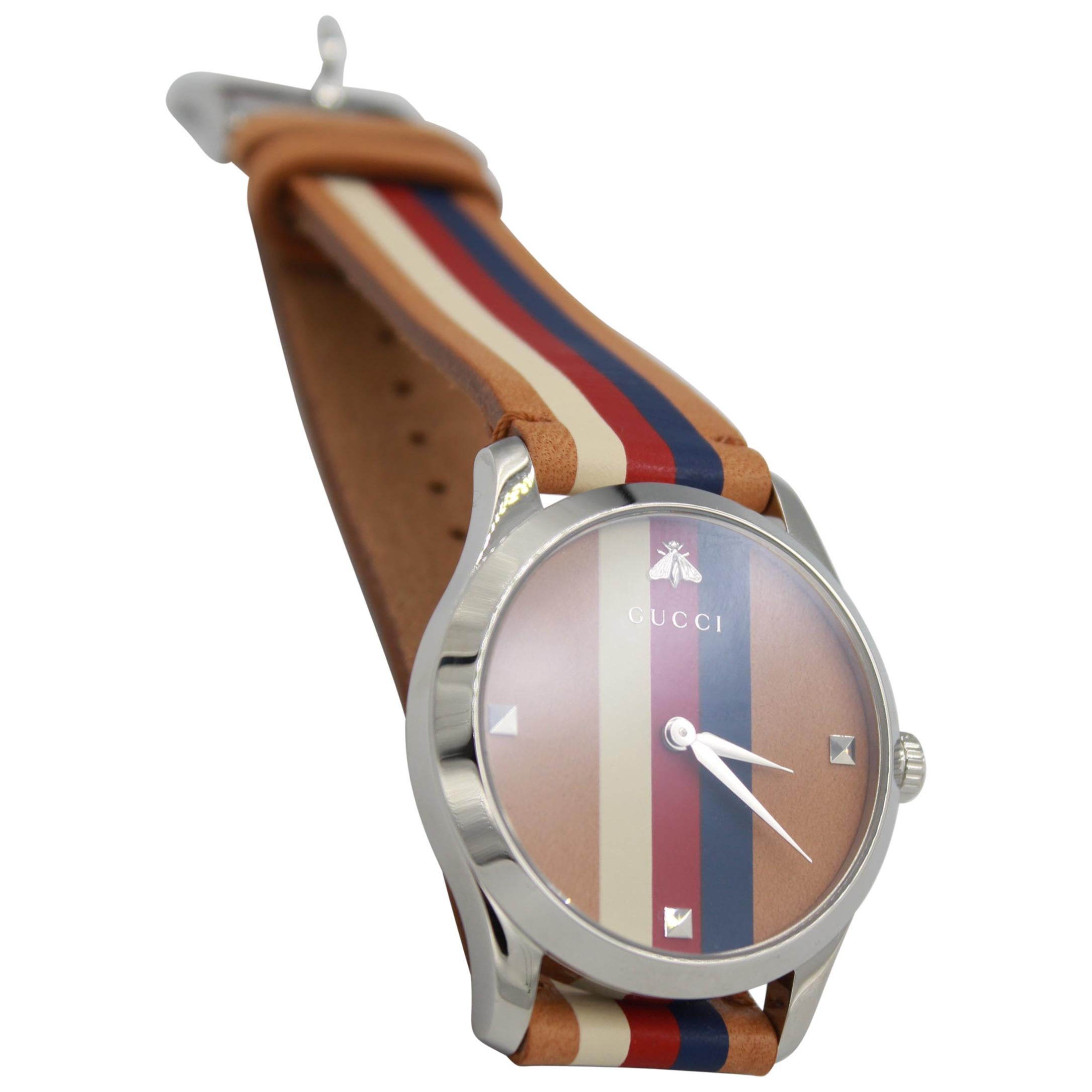 Gucci watch in brown, blue, red and white leather. For Sale