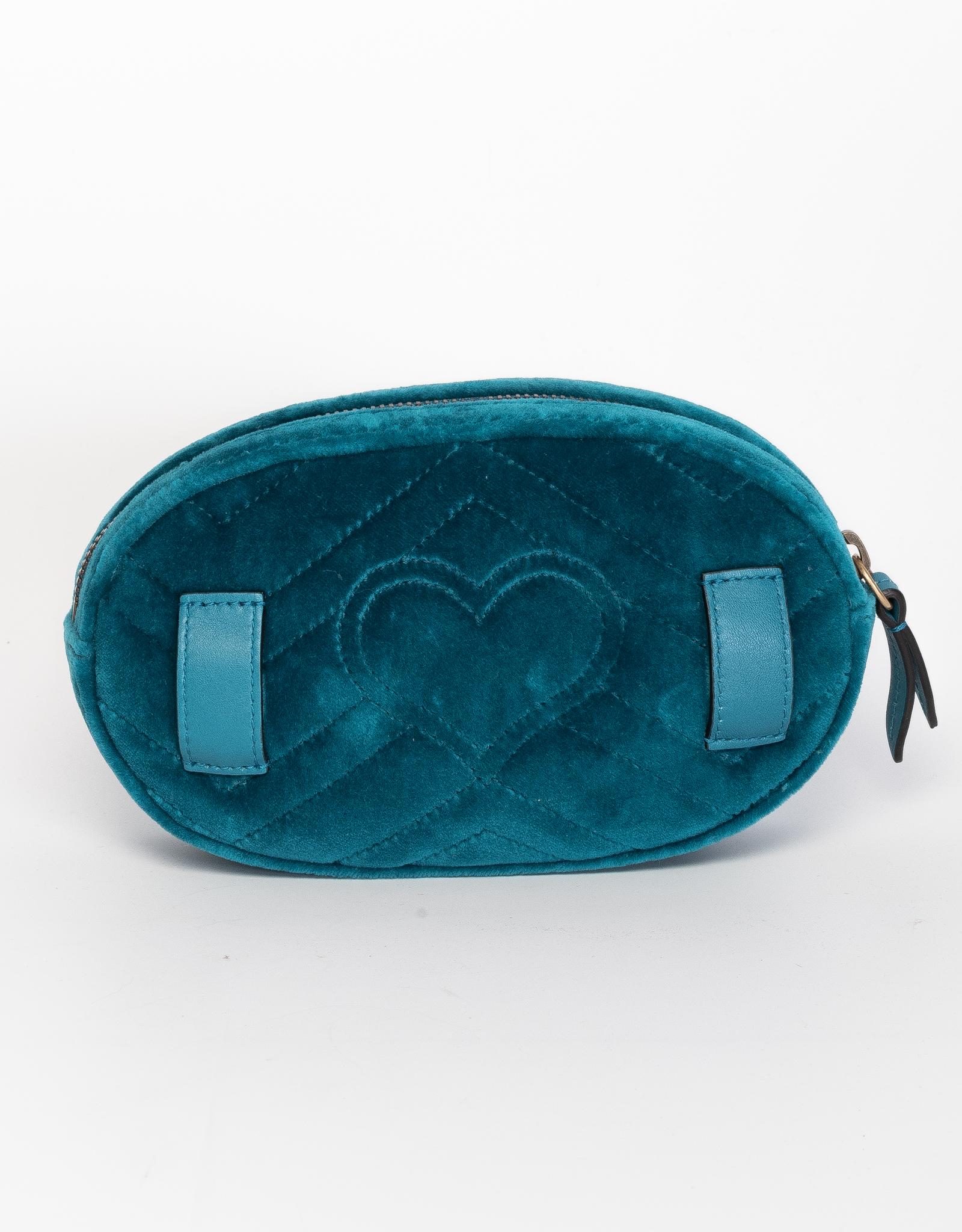 This belt bag is made out of water green chevron stitched velvet with flower embroidery. Featuring an oval retro shape with a leather belt to be worn as a belt bag.

COLOR: Water green/ turquoise blue
MATERIAL: Velvet with silk interior
ITEM CODE: