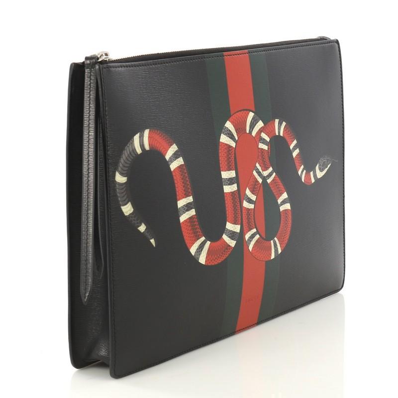 This Gucci Web and Snake Messenger Bag Printed Leather Large, crafted from black leather, features flat leather strap, snake print against web detail, and aged silver-tone hardware. Its zip closure opens to a gray microfiber interior with zip