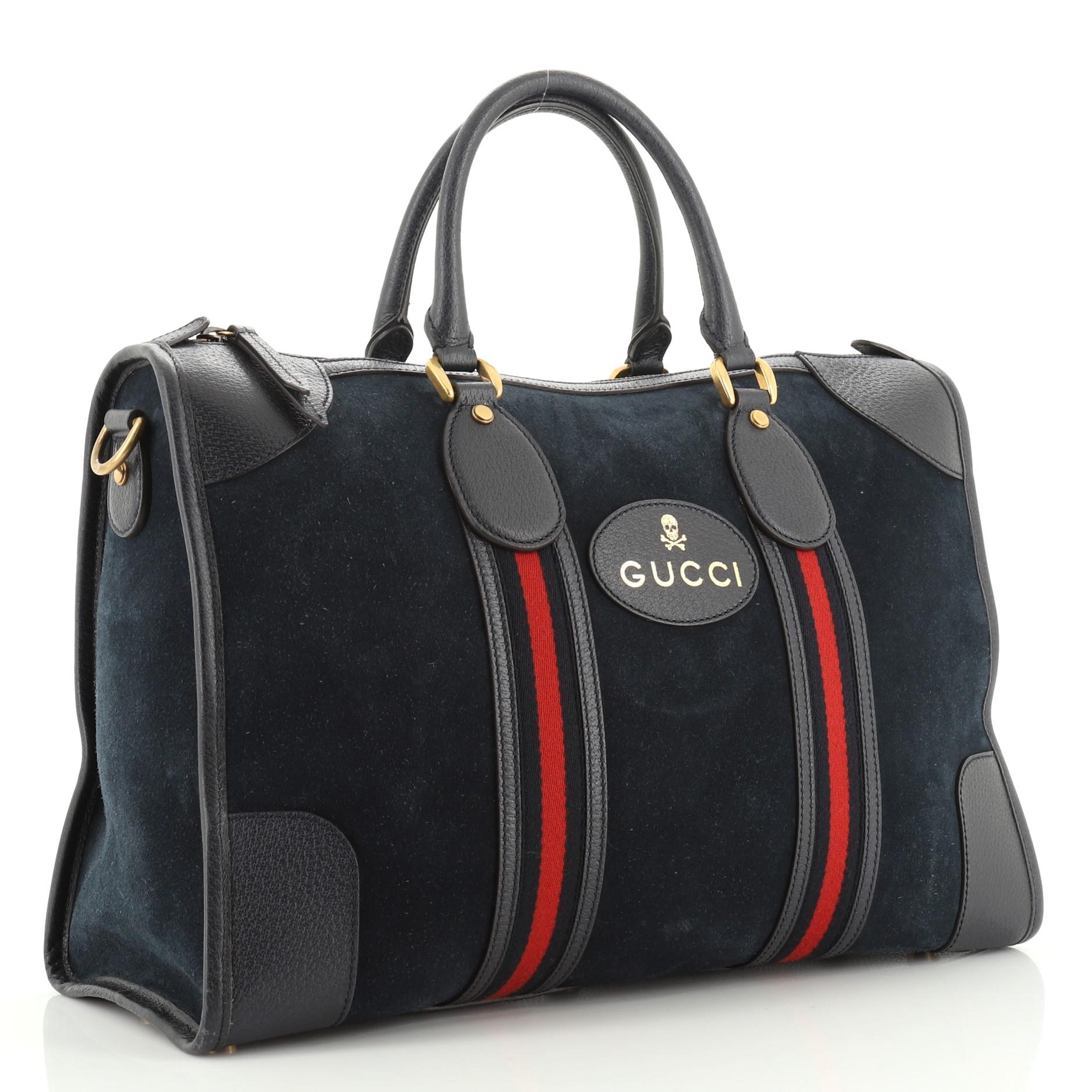 This Gucci Web Convertible Duffle Bag Suede Medium, crafted from blue suede, features dual rolled handles, Web detailing and aged gold-tone hardware. Its zip closure opens to a neutral fabric interior with zip and slip pockets.

Estimated Retail