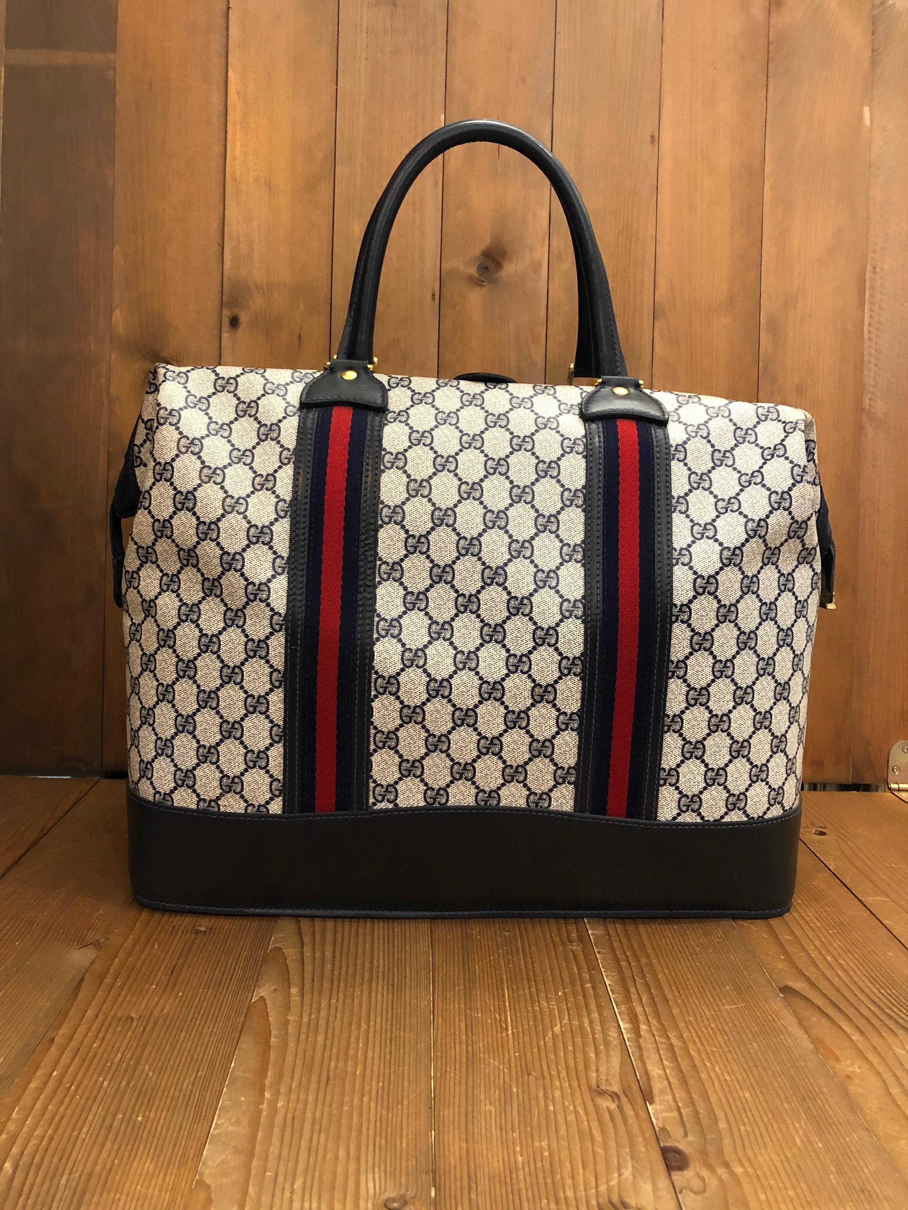 This rare Gucci Web doctor duffle in GG monogram coated canvas and leather from the 1970s era. 

Material: Monogram Canvas/Leather
Color: Navy
Origin: Italy
Measurements: approximately 17 x 13 x 9.5 inches

Condition: Minor marks on canvas and