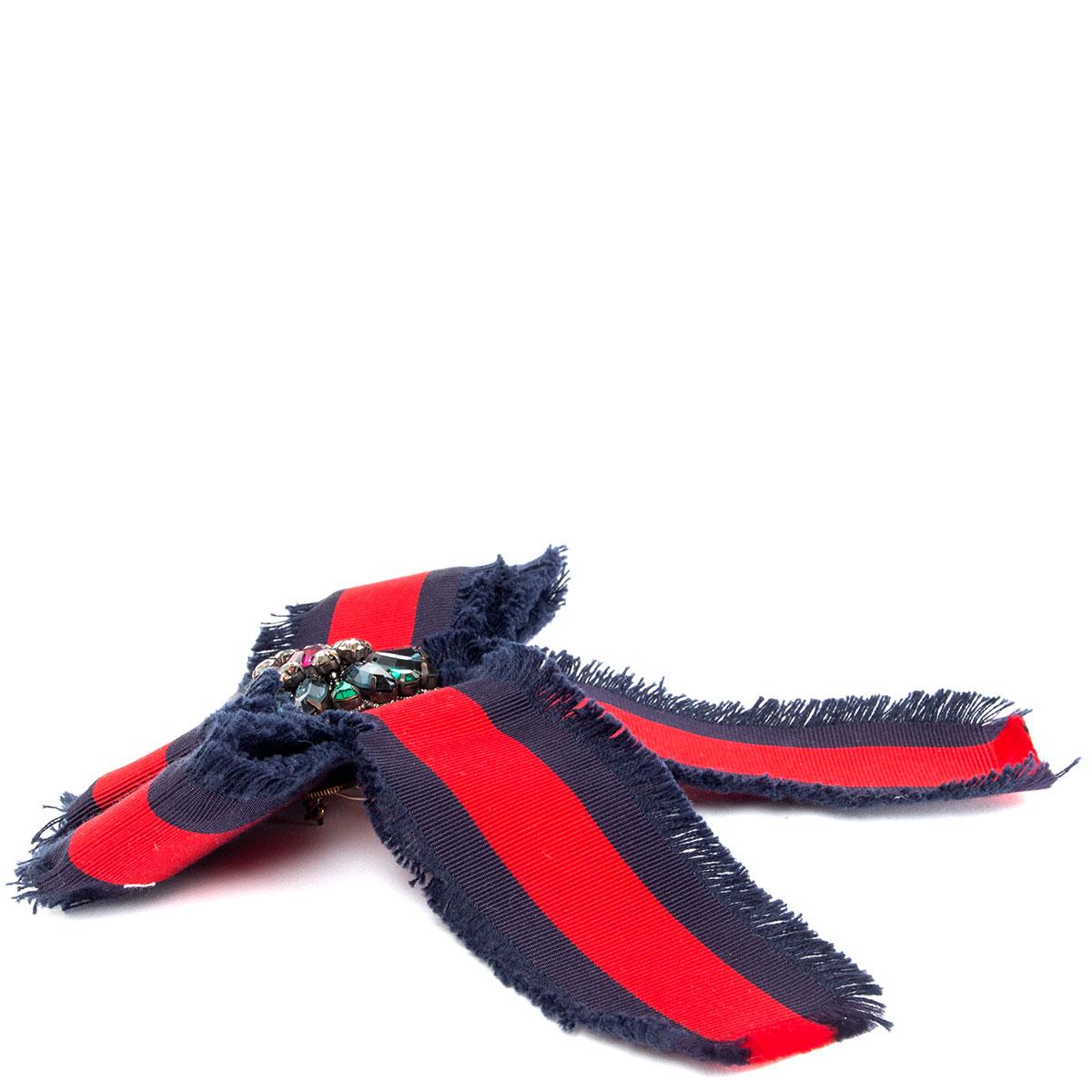100% authentic Gucci Web bow brooch in classic red and navy grosgrain embellished with pink, blue, green and clear crystals. Has been worn and is in excellent condition. 

Measurements
Width	15cm (5.9in)
Length	15cm (5.9in)

All our listings include
