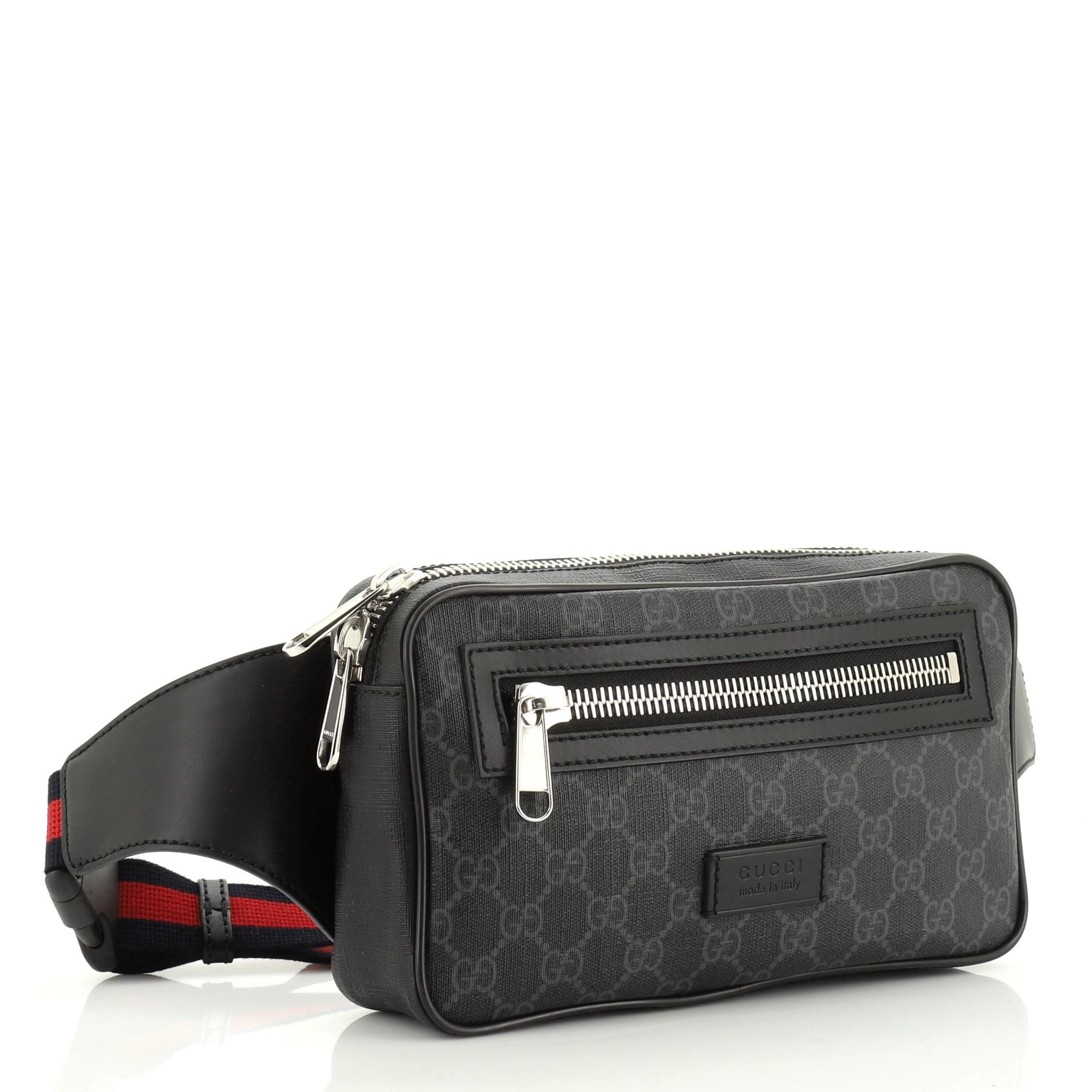 This Gucci Soft Zip Belt Bag GG Coated Canvas Small, crafted from black GG coated canvas, features signature web strap, exterior front zip pocket and silver-tone hardware. Its zip closure opens to a black fabric interior. 

Condition: Great. Minor