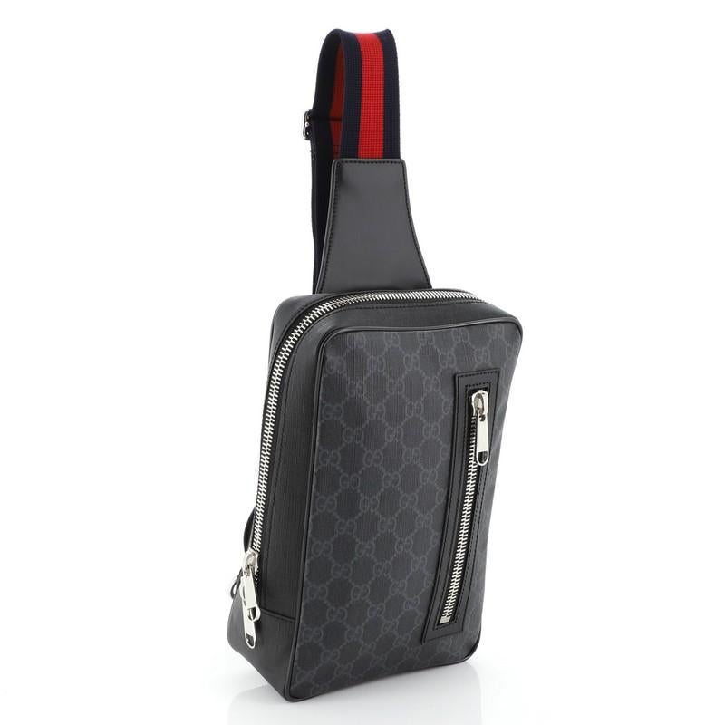This Gucci Web Strap Sling Bag GG Coated Canvas Small, crafted from black GG coated canvas, features web sling strap, exterior front zip pocket and silver-tone hardware. Its zip closure opens to a black fabric interior. 


Condition: Excellent.