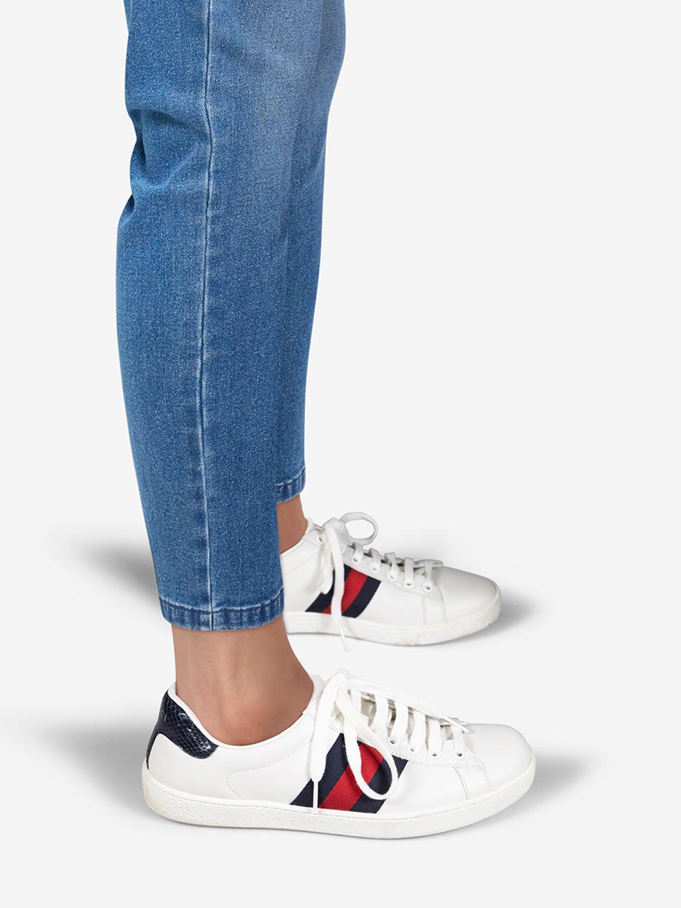 CONDITION is Very good. Minimal wear to trainers is evident. Minimal wear to both sides of both shoes, the toe tips and the laces on the left shoes where discolouration can be seen on this used Gucci designer resale item. Comes with original dust