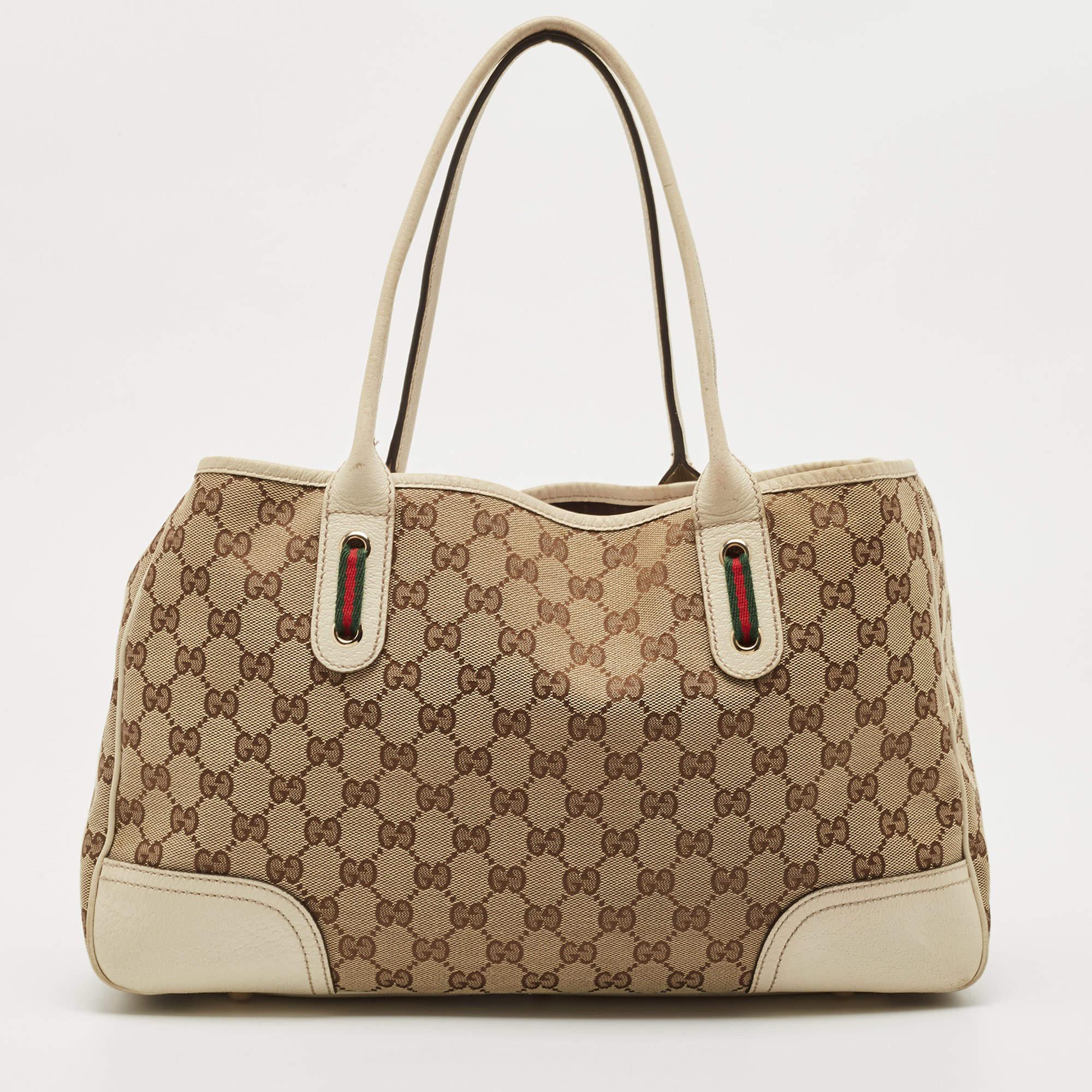 Renowned for its exclusive craftsmanship, this Gucci Princy tote will live up to your expectations. A splendid complement to your dress will be this popular bag in beige and white. This sleek and spacious GG coated canvas bag is luxurious enough to