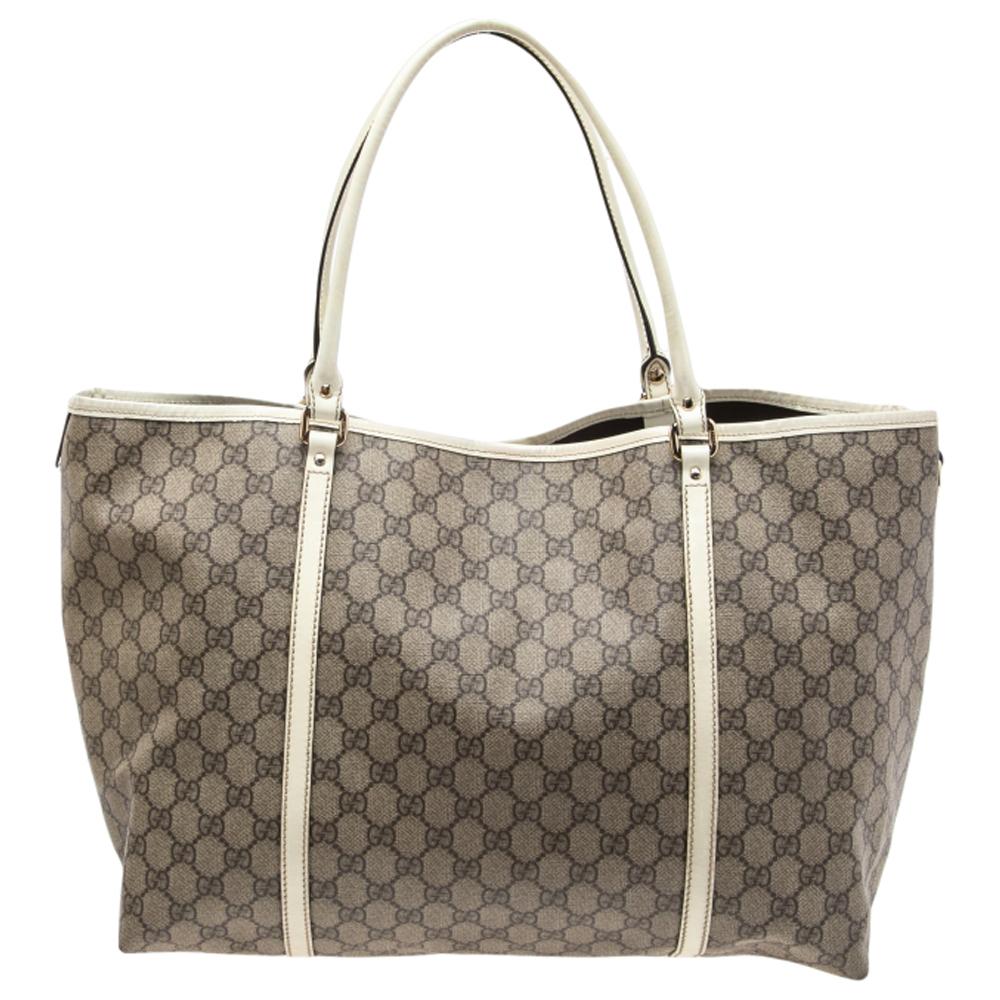 Featuring two handles and an exterior crafted from signature GG Supreme canvas, this Gucci Joy tote exudes just the right amount of sophistication. The bag also features a capacious fabric interior to house all your essentials. This piece is