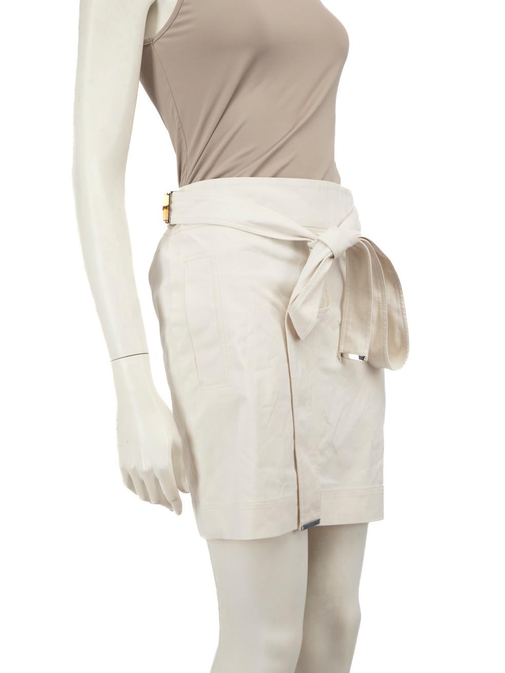 CONDITION is Very good. Minimal wear to skirt is evident. Light discolouration to the rear bottom centre on this used Gucci designer resale item.
 
 
 
 Details
 
 
 White
 
 Cotton
 
 Skirt
 
 Mini
 
 Belt with bamboo buckle
 
 Back zip and hook