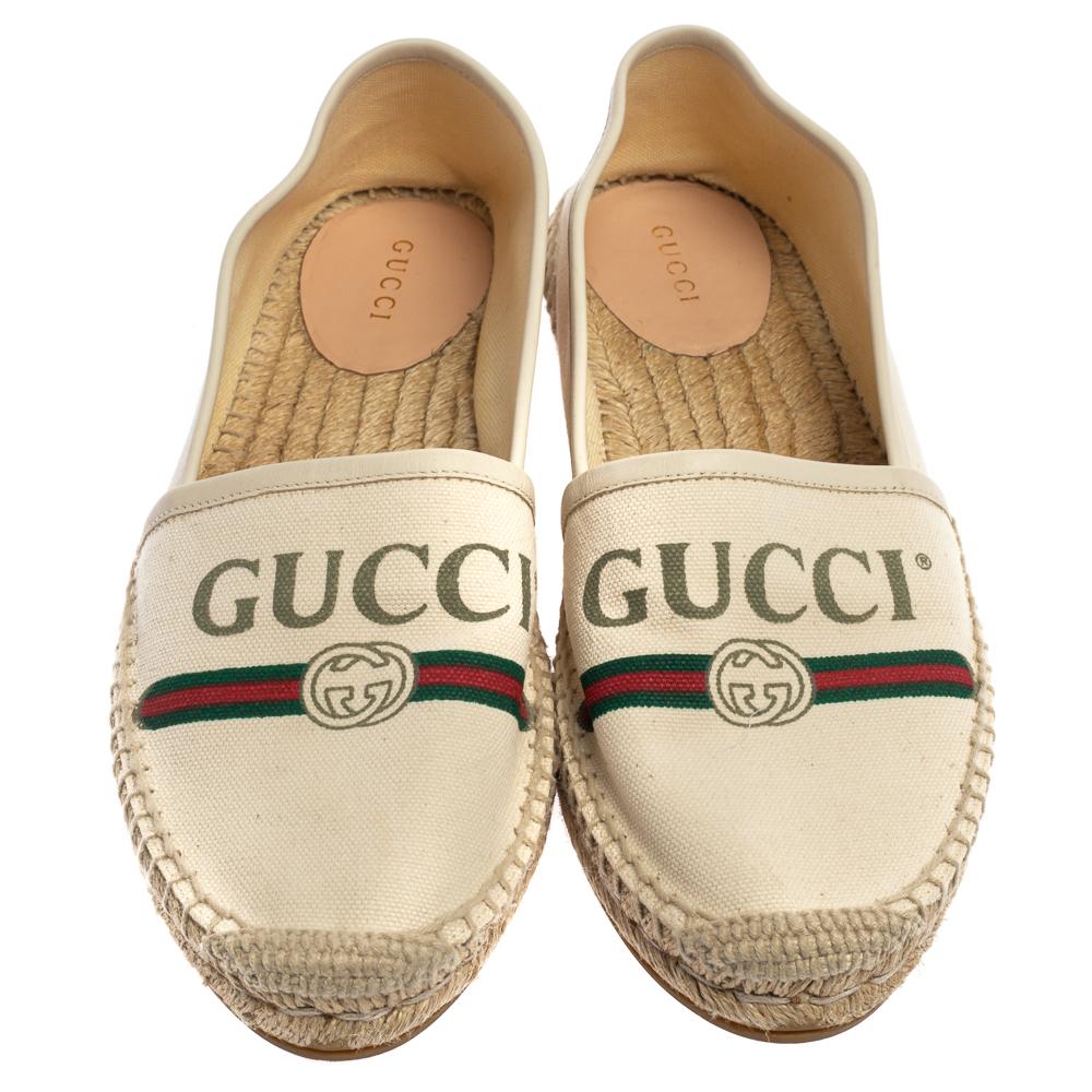 Gucci's retro-inspired logo now appears on footwear and is added to these espadrilles alongside the webbed stripes. They are made from white canvas reinforced with leather around the edges and have thick rubber soles. Wear yours with everything from