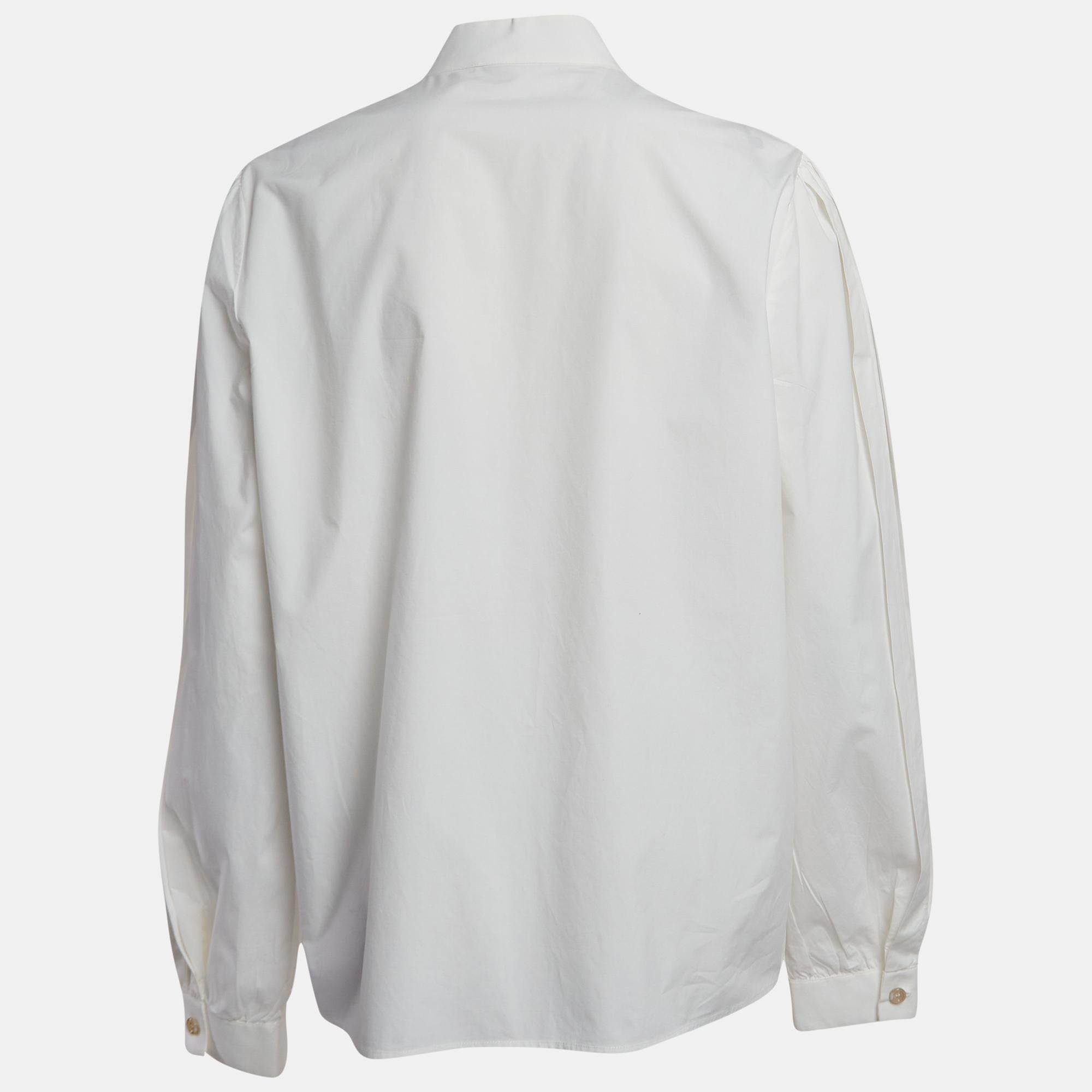 Step into elegance with the Gucci shirt. Crafted with precision and finesse, this garment exudes sophistication. Its crisp white hue and fly front design elevate any ensemble, while the soft cotton fabric ensures comfort and breathability throughout
