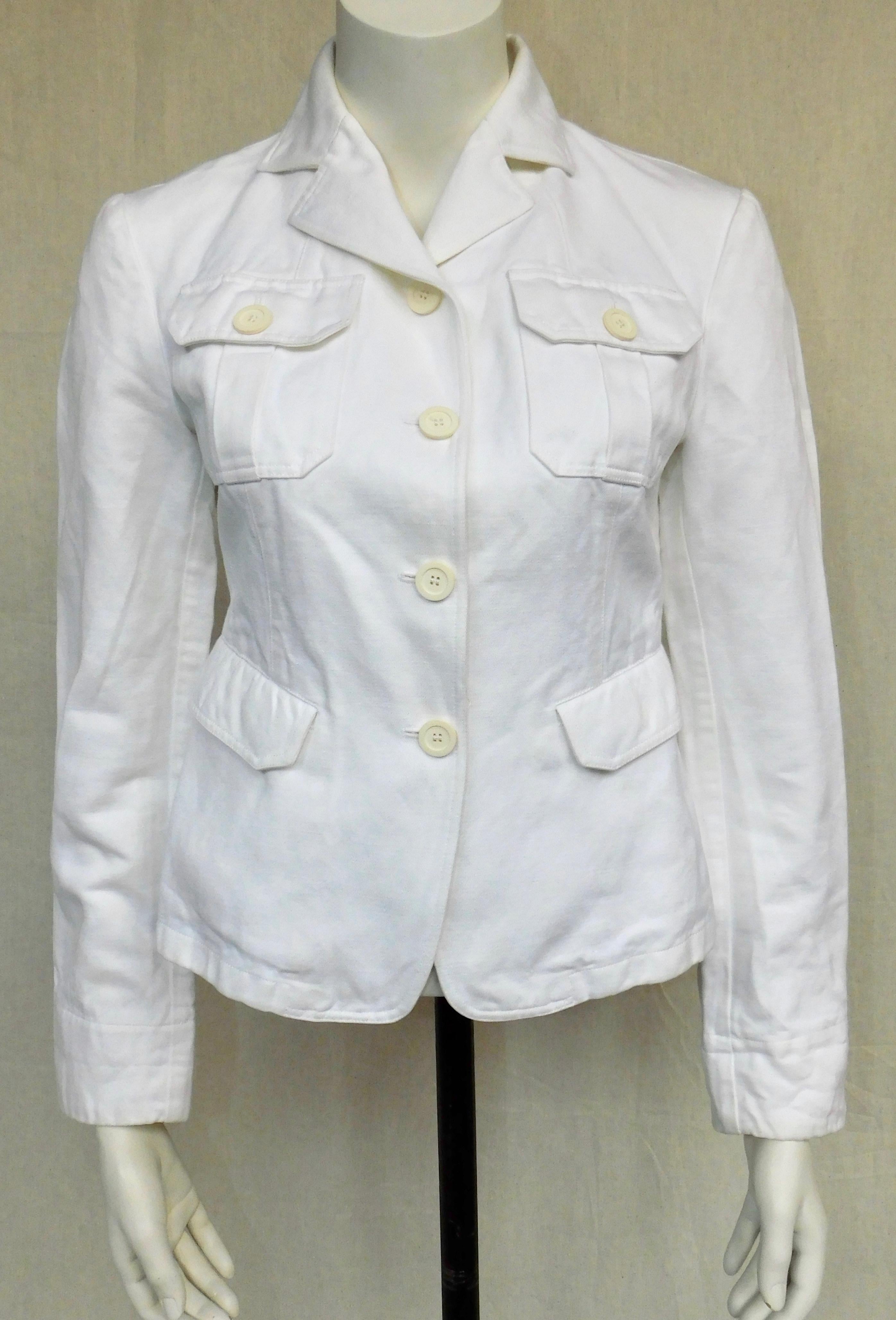 This classic white  jacket is from 2001 made from a blend of cotton and linen with the feel of soft mid-weight denim. Italian size 42 is a USA 6 or small.The shoulder width is 40 cm.
An authentic Italian made Gucci women's wear jacket made by