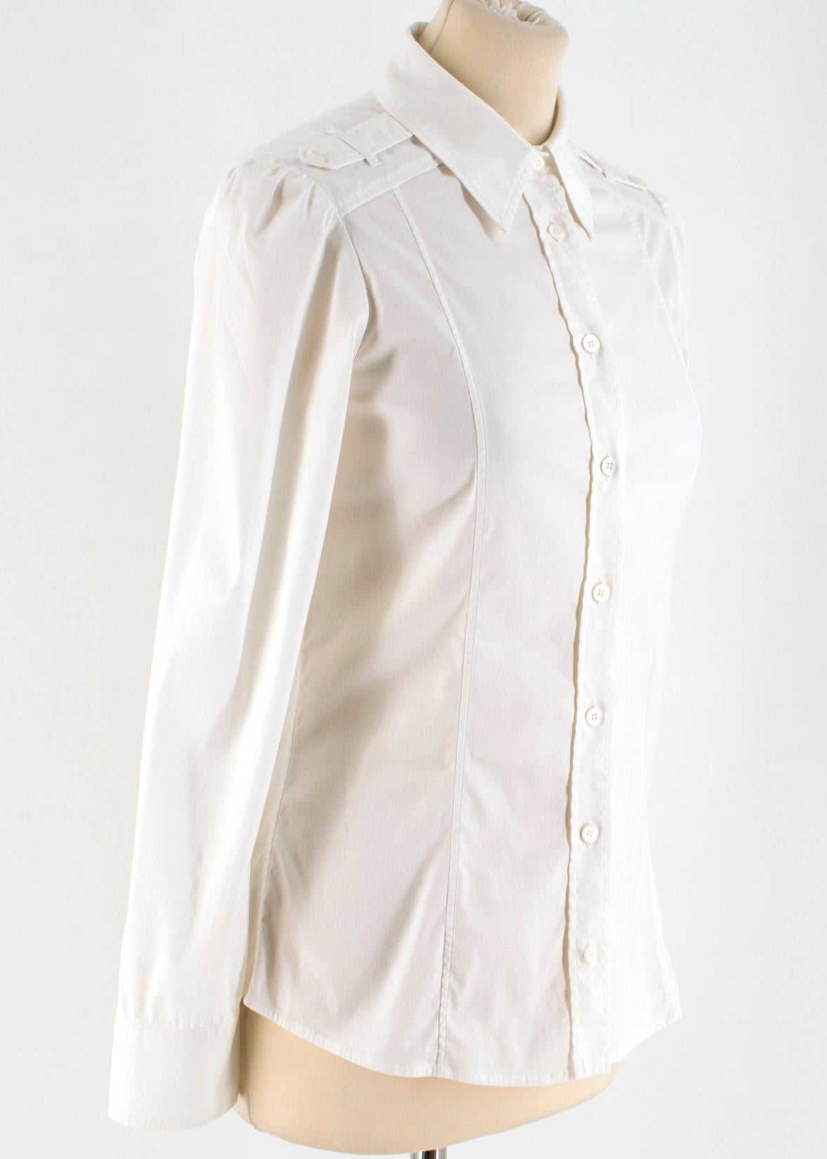 Gucci White Cotton Shirt W/ Epaulettes

- A crisp Cream/White button-down Shirt
- Features a Epaulette (button shoulder piece)
- 100% Cotton
- Made in Italy
- Point Collar
- Two thin line on either side of the shirt (front and back)

Please note,