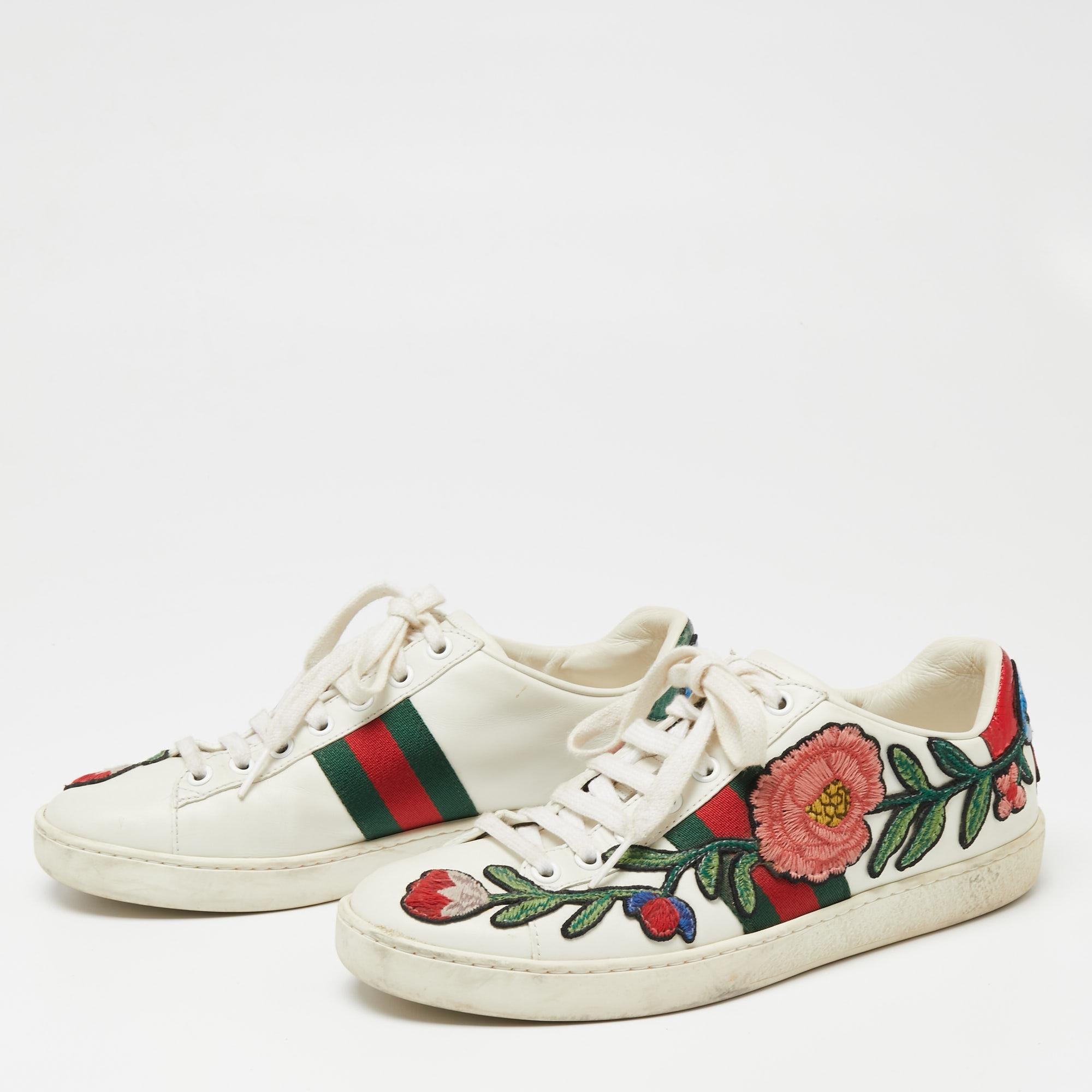 How one's heart flutters at the sight of these Gucci sneakers! Beautifully crafted from leather, they carry the signature web stripe and floral embroidery on the sides. Sneakers are definitely the rage at the moment but these Gucci ones are just a