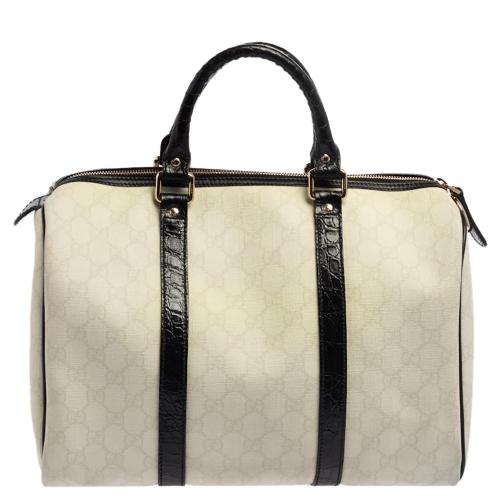 This handbag from the house of Gucci will reflect your fabulous choices. This Joy Boston bag is stylish, playful, and an absolute must-have. Crafted in Italy from GG coated canvas, it comes in a white hue and is beautifully adorned with floral