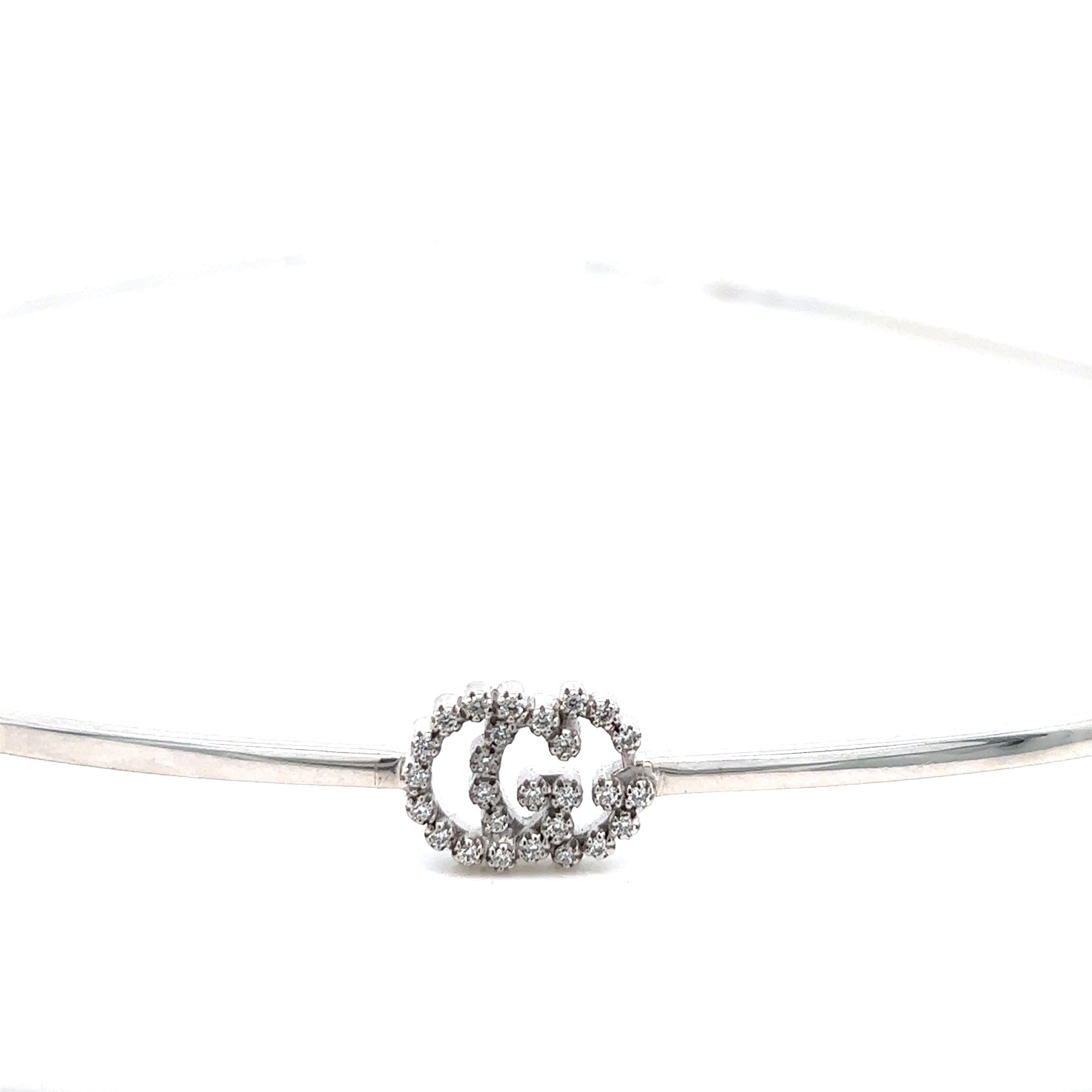 Gucci choker necklace; marked Gucci, made in Italy, M, Au750, 1231 VI

18 karat white gold, small round-cut diamonds of approximately 0.20 carat

Size: width 4.38 inches, length 4.25 inches
Total weight: 8.9 grams