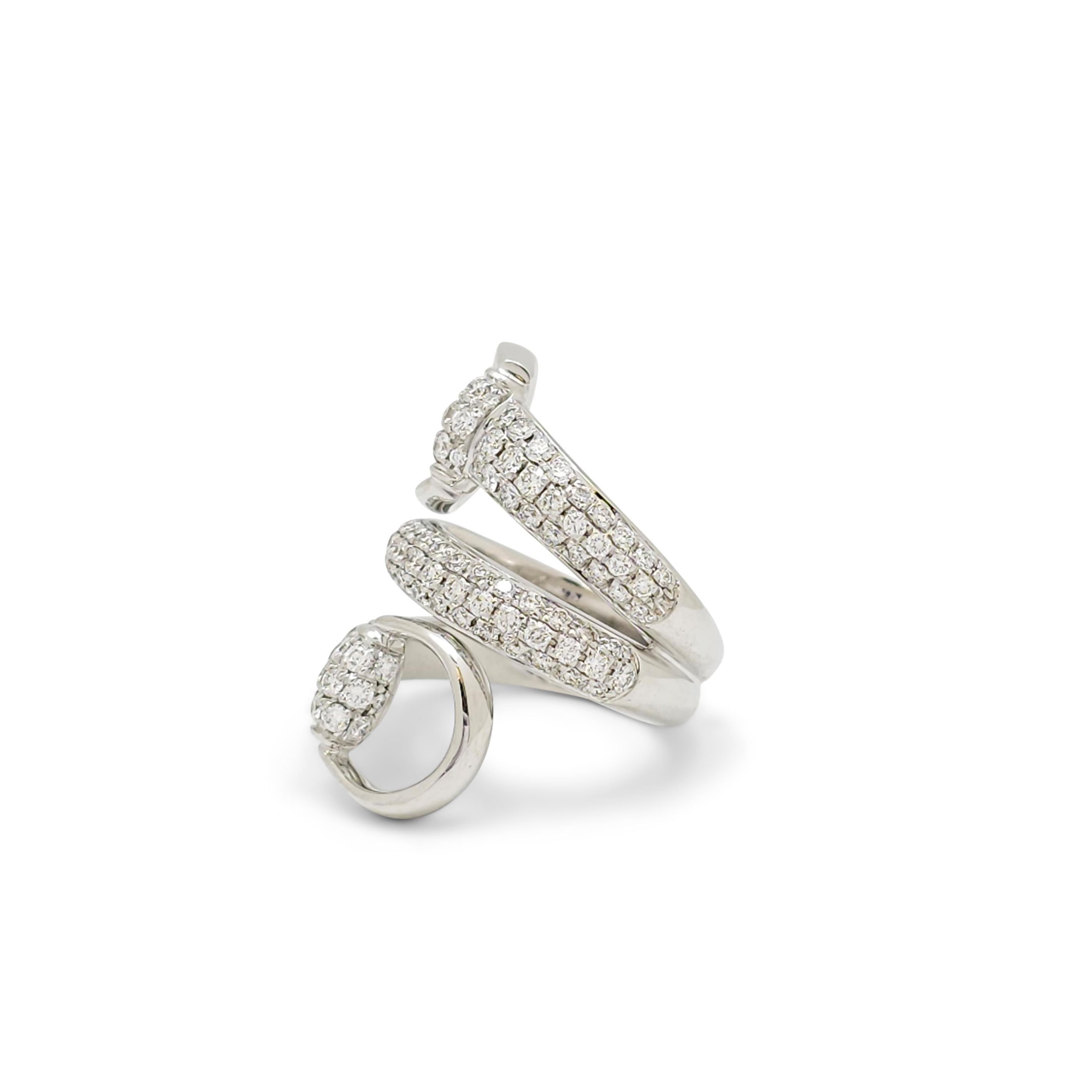 Authentic Gucci horsebit contraire ring crafted in 18 karat white gold.  The equestrian design wraps around the finger twice, displaying opposite ends of the horsebit at the top and bottom, and is set with approximately 1.95 carats of glittering
