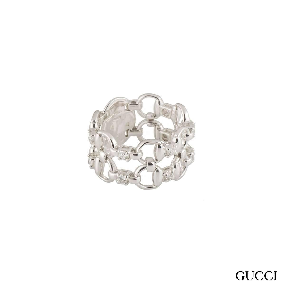 A simple 18k white gold diamond Gucci ring from the Horsebit collection. The ring comprises of the open work iconic horseshoe design all the way around. The ring measures 11m in width and is a size 13. The ring has a gross weight of 7.90 grams.

The