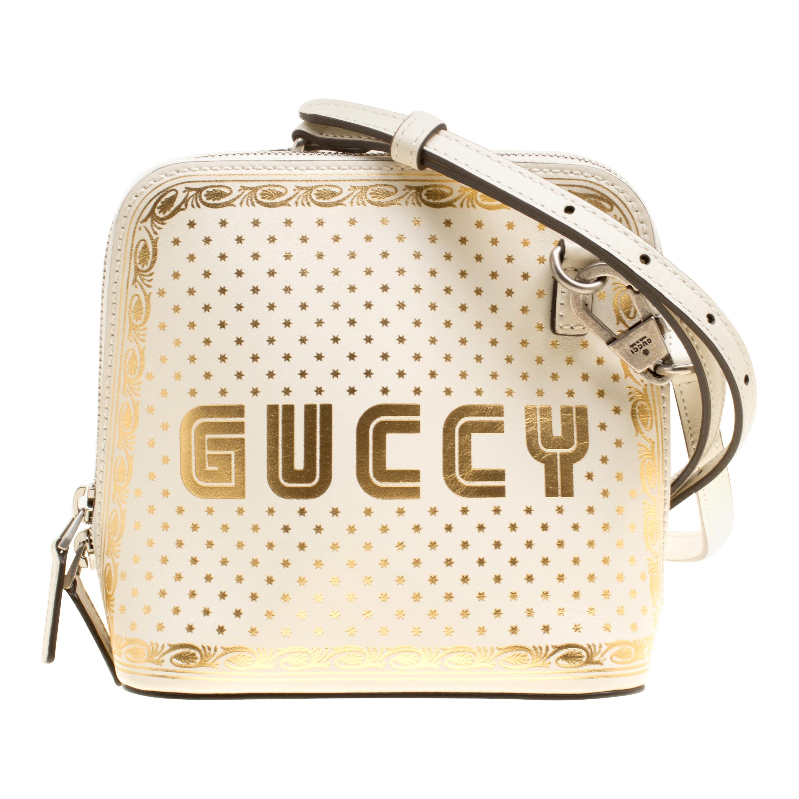 white and gold gucci bag