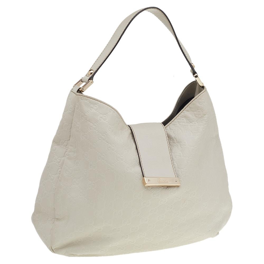 Keep it classy and elegant with this bag from the house of Gucci. Incorporate an in-vogue touch to your look with this white bag. Crafted to a smooth finish, this Guccissima leather bag adds oodles of sophistication to your look.

Includes: Original