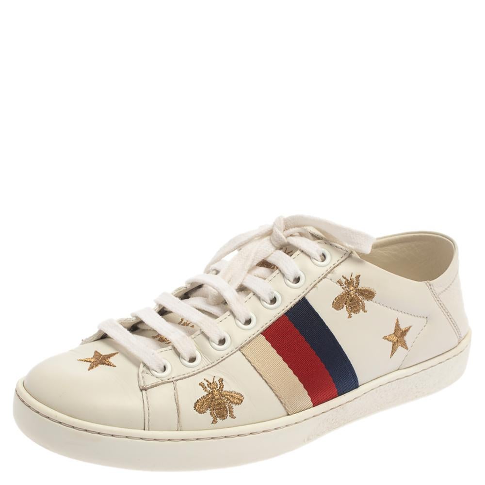 These sneakers from Gucci are all you need to make an impression and ace the sneaker game! The white sneakers are crafted from leather and feature round toes and lace-ups on the vamps. They have been adorned with the embroidered bees and stars and