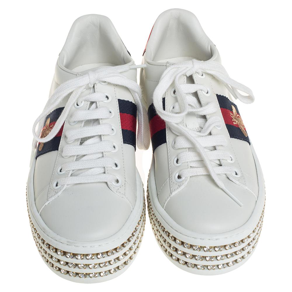 Stacked with signature details, this Gucci pair is rendered in leather and is designed in a low-cut style with lace-up vamps. The pair is decorated with crystal embellishments and the bee motif (Gucci code from the 1970s) on the Web. Complete with