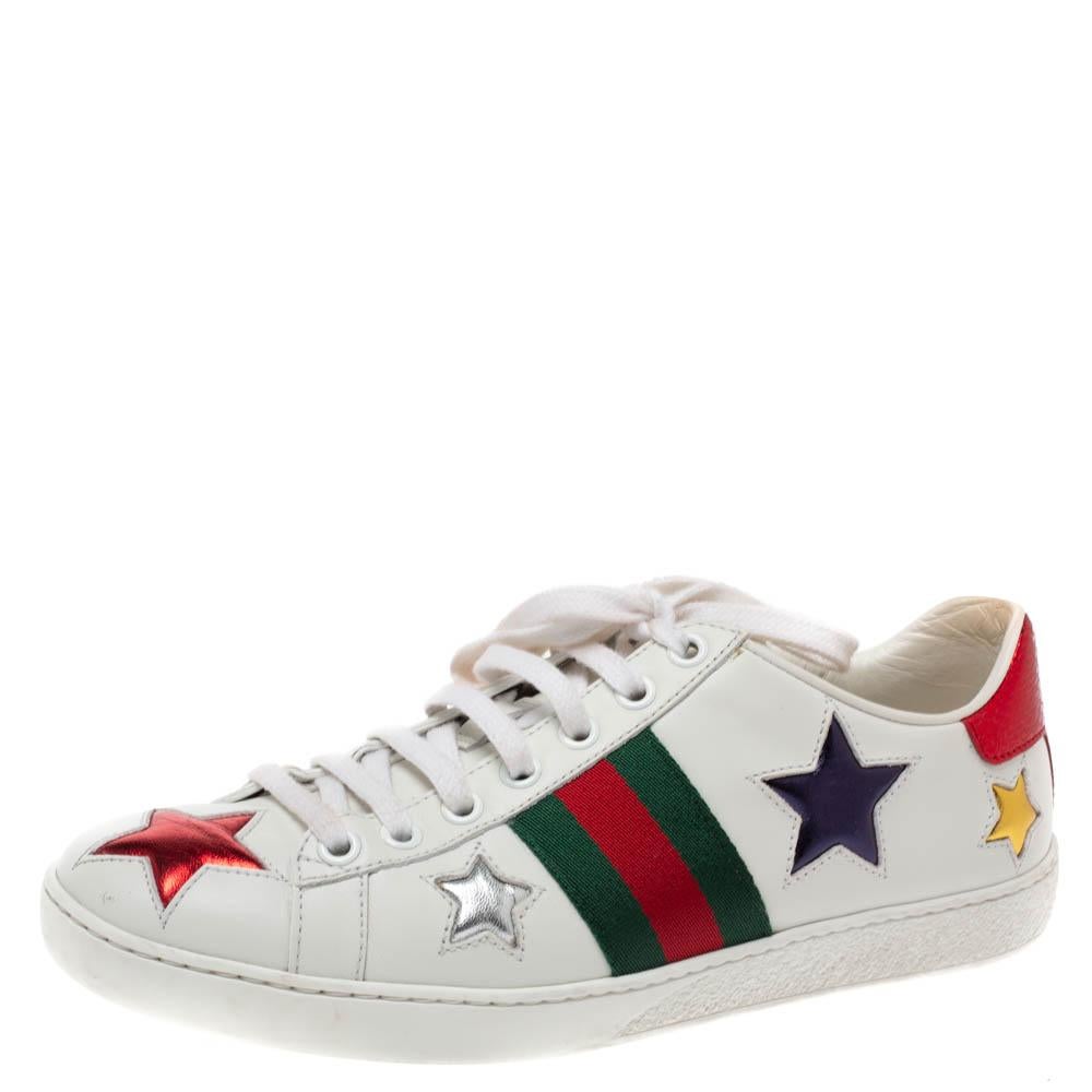 Stacked with signature details, this Gucci pair is rendered in leather and is designed in a low-cut style with lace-up vamps. They have been fashioned with the iconic web stripes and metallic star appliques. Complete with red and green embossed
